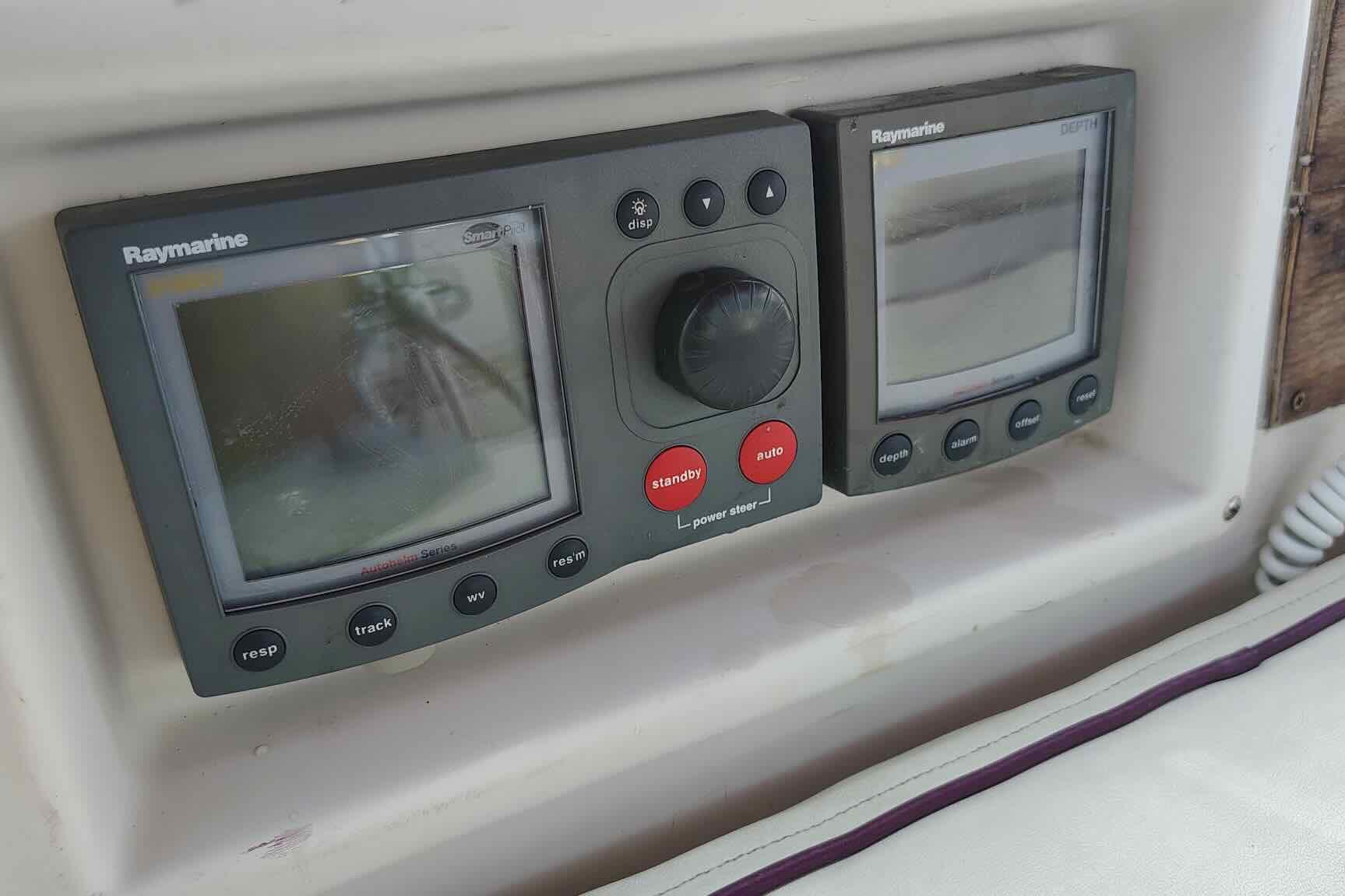 Raymarine navigation instruments on 1989 Island Packet 35 sailboat dashboard.