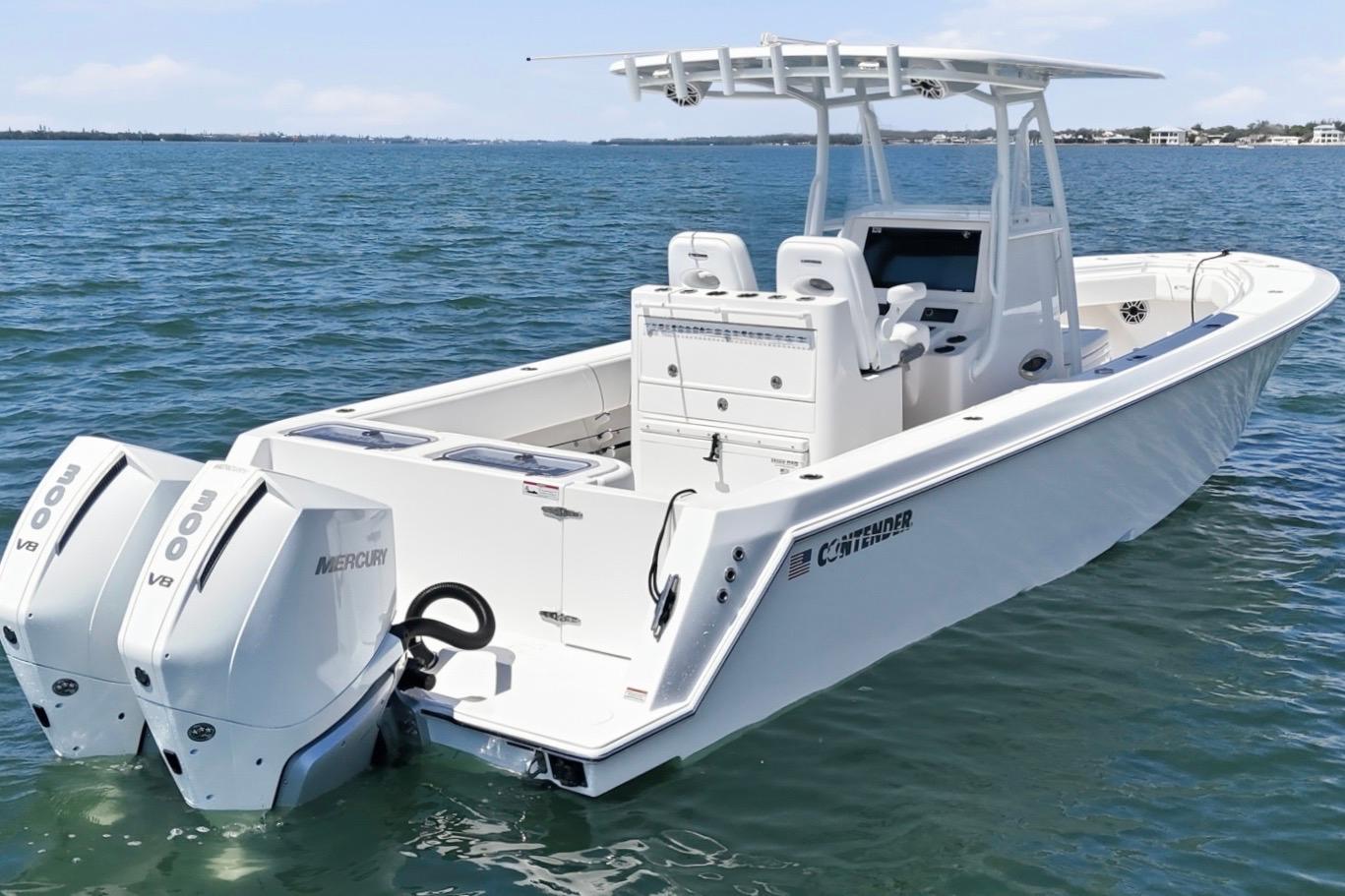2024 Contender 32 ST boat with dual Mercury V8 engines on open water.