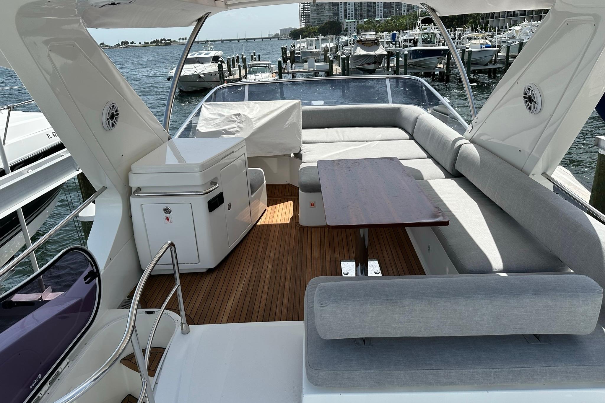 Luxurious 2013 Azimut Fly 53 yacht interior with elegant seating and wooden flooring.