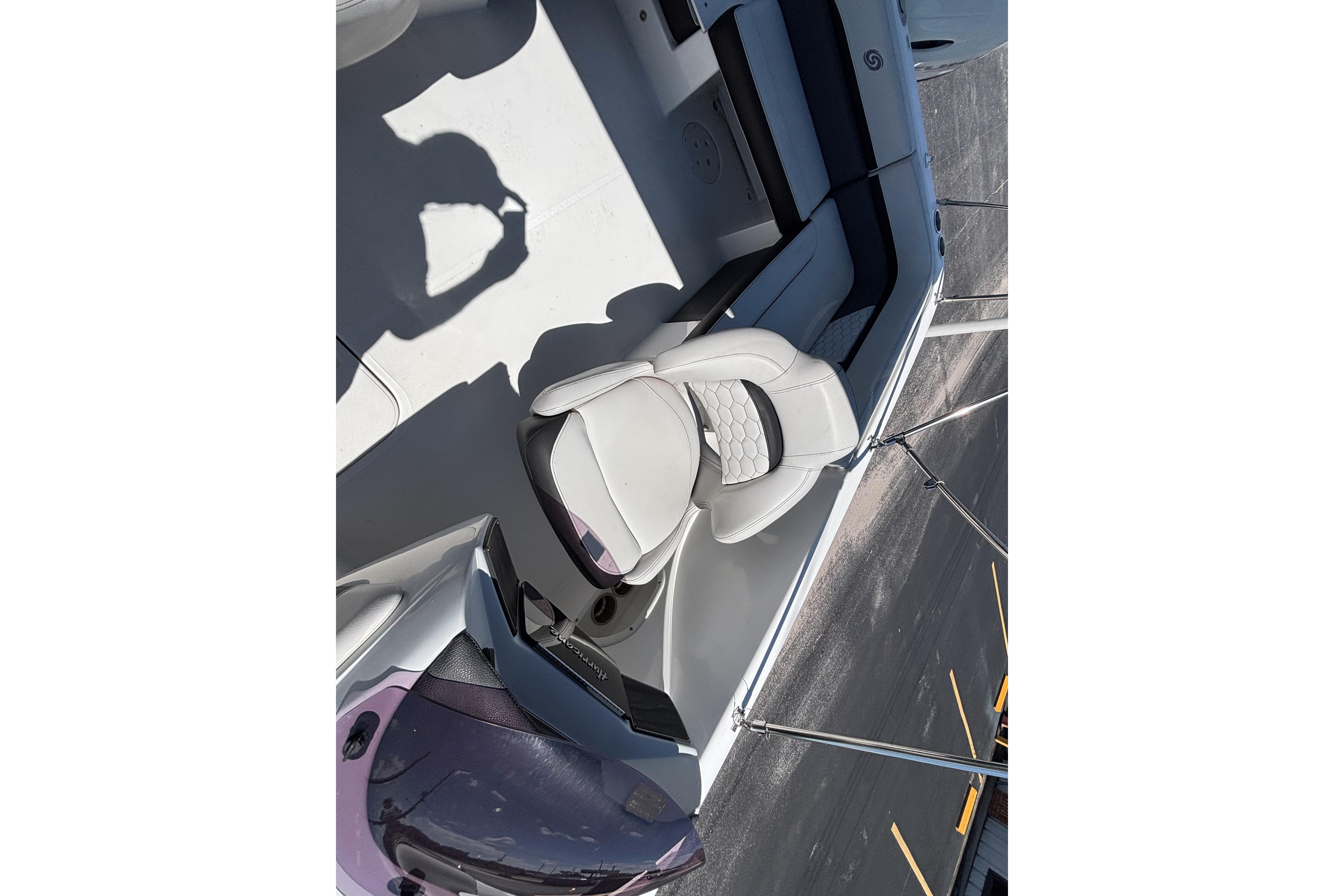 2019 Hurricane Sundeck Sport 218 OB boat interior with white seating and sleek design.