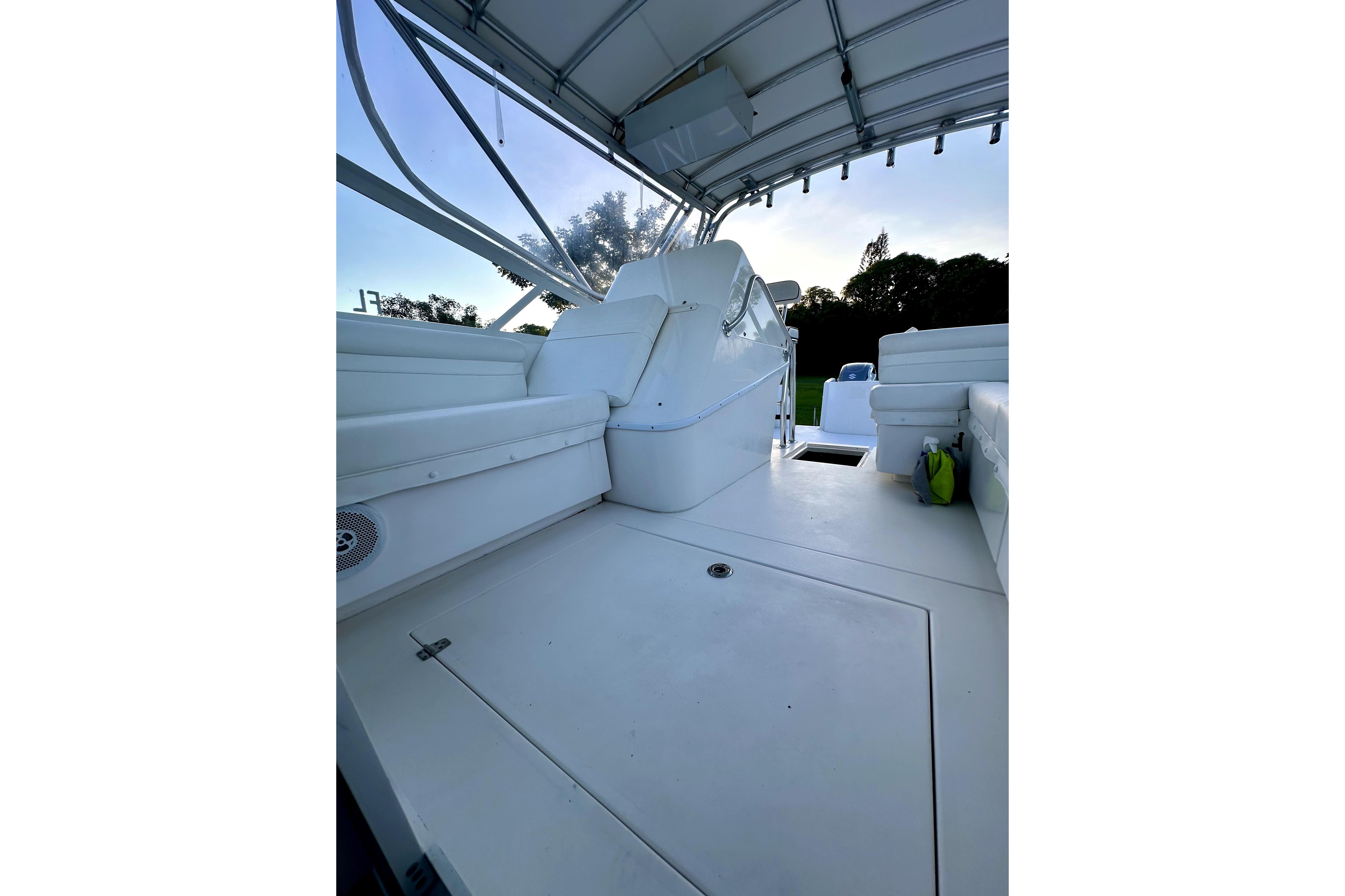 2006 Contender 35 Express Side Console boat interior with seating and canopy.