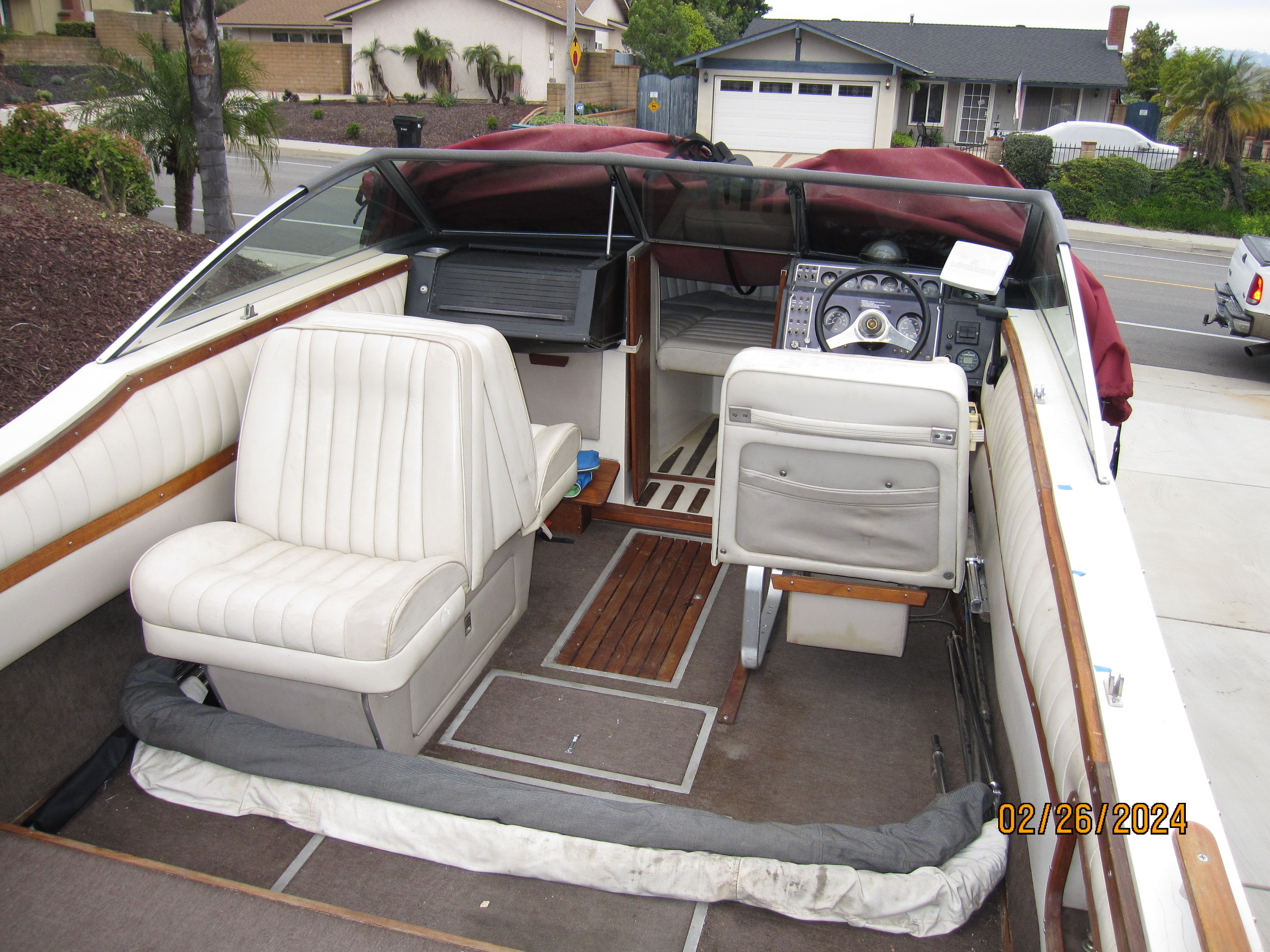 Interior of a 1990 Cobalt Bowrider Classic boat with white seats.