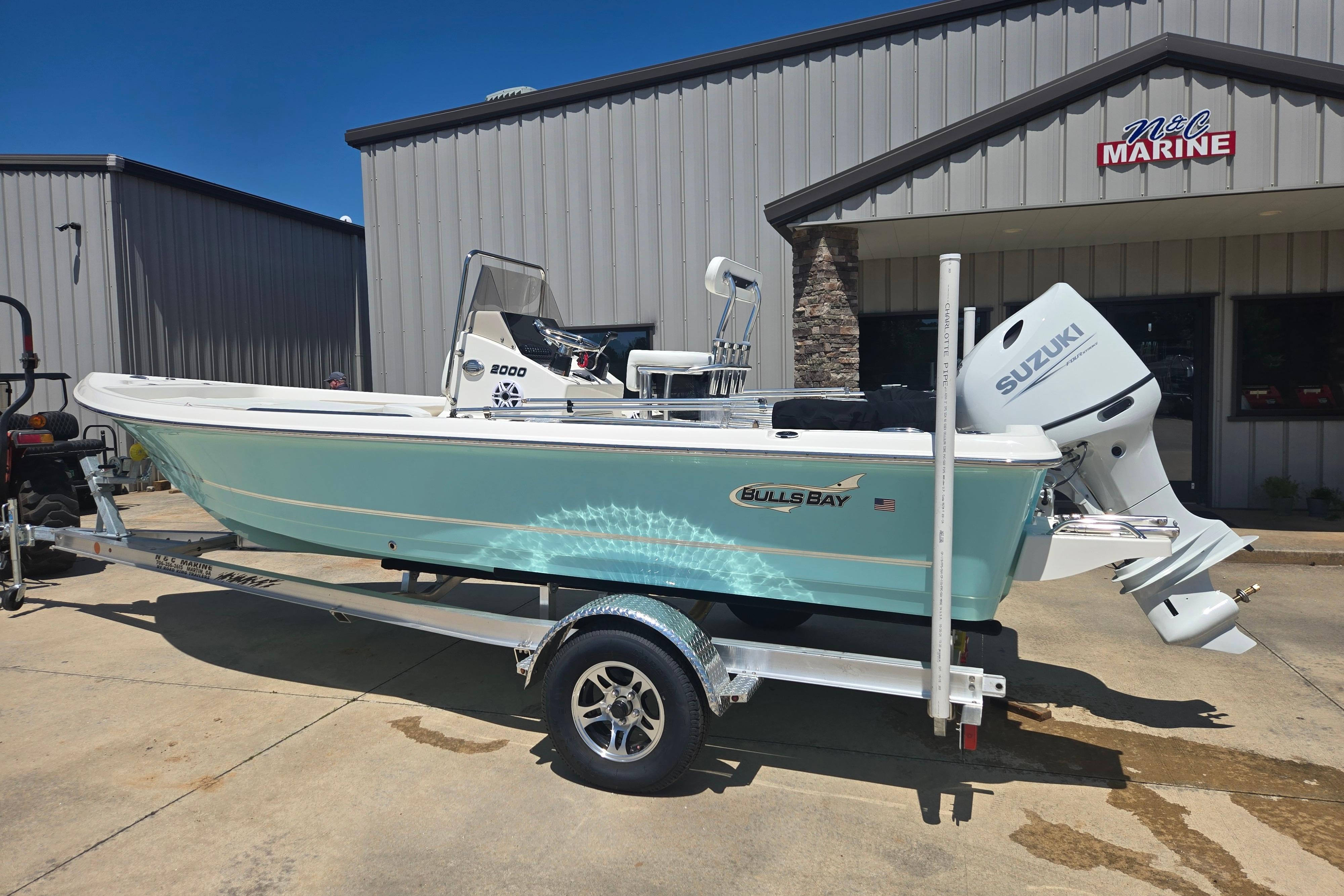 2026 Bulls Bay 2000 boat with Suzuki engine on trailer at N&C Marine dealership.