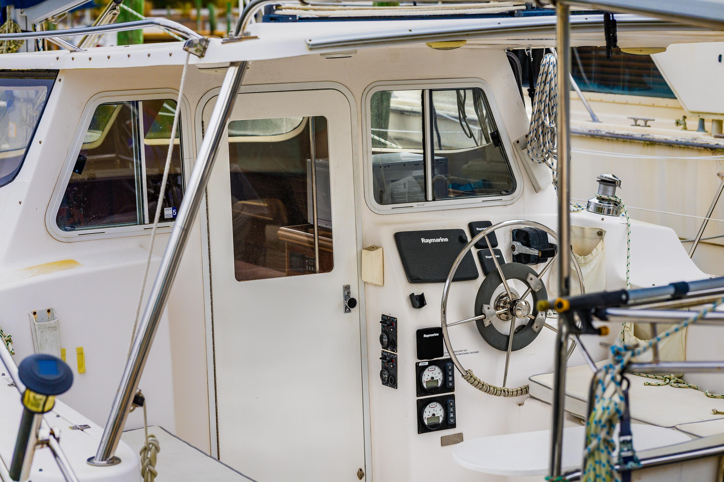 Cockpit of 2014 Gemini Legacy 35 sailboat with steering wheel and navigation instruments.