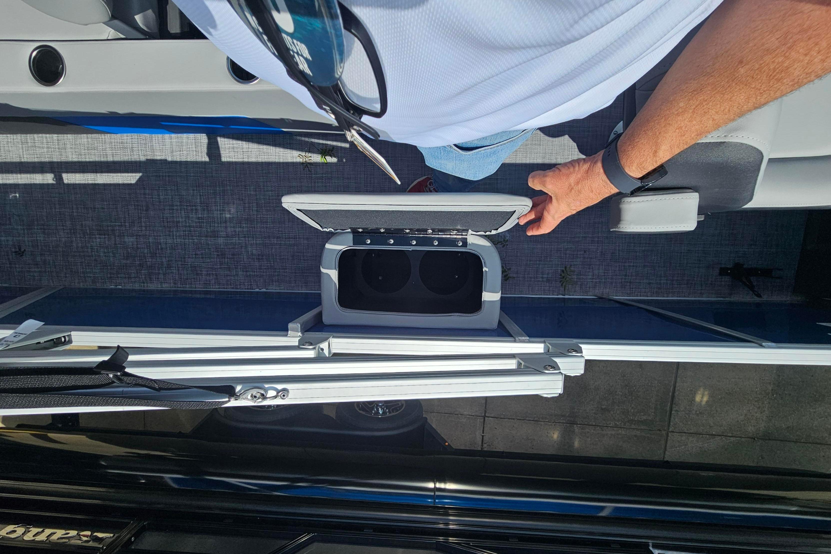 2026 Sun Tracker Party Barge 22 RF DLX with open storage compartment, viewed from above.