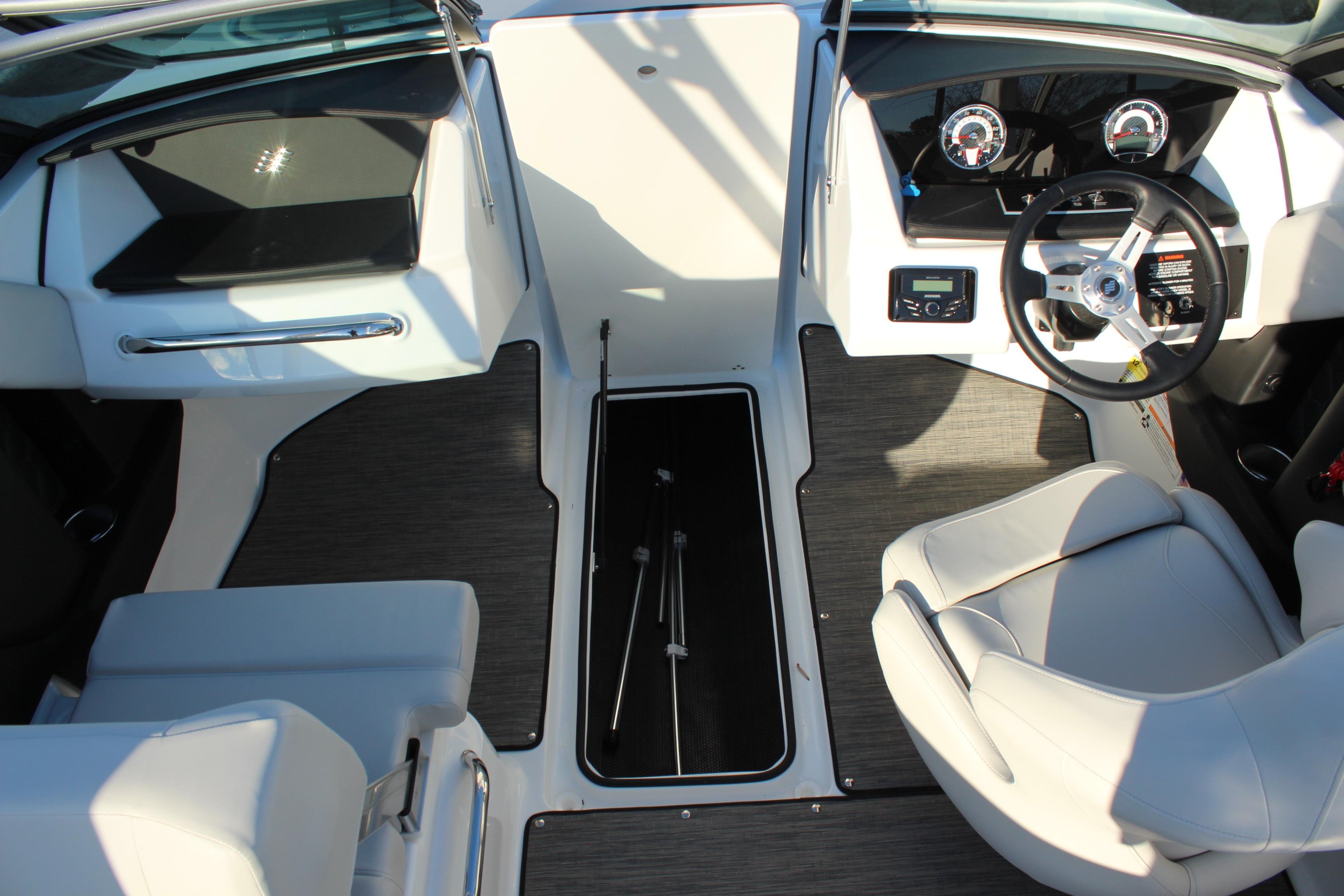 2026 Four Winns H2 Freedom boat interior with modern dashboard and seating.