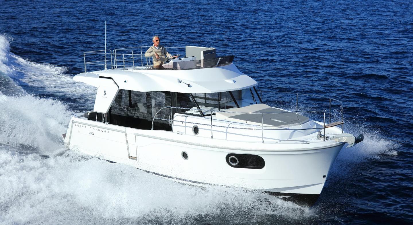 Manufacturer Provided Image: 2020 Beneteau Swift Trawler 30 cruising on open water, showcasing sleek design and performance.