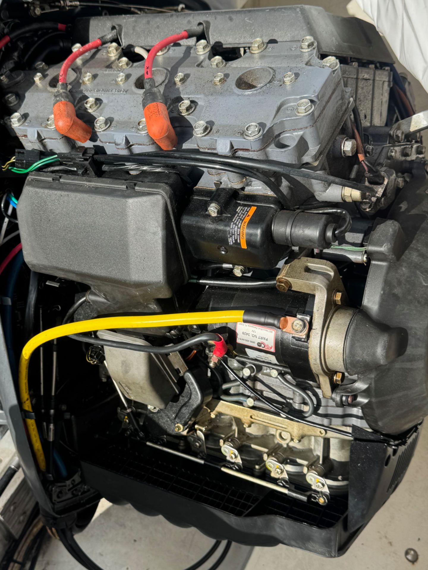 1973 SeaCraft TSUNAMI boat engine, close-up view.