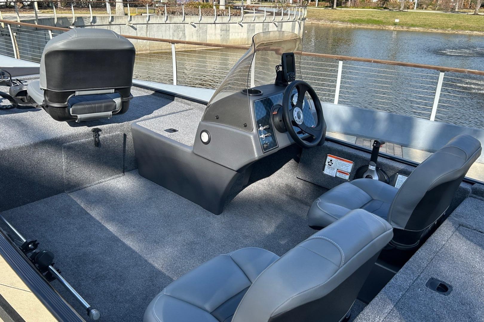 2026 Tracker Bass Tracker Classic XL boat interior with steering console and seating.