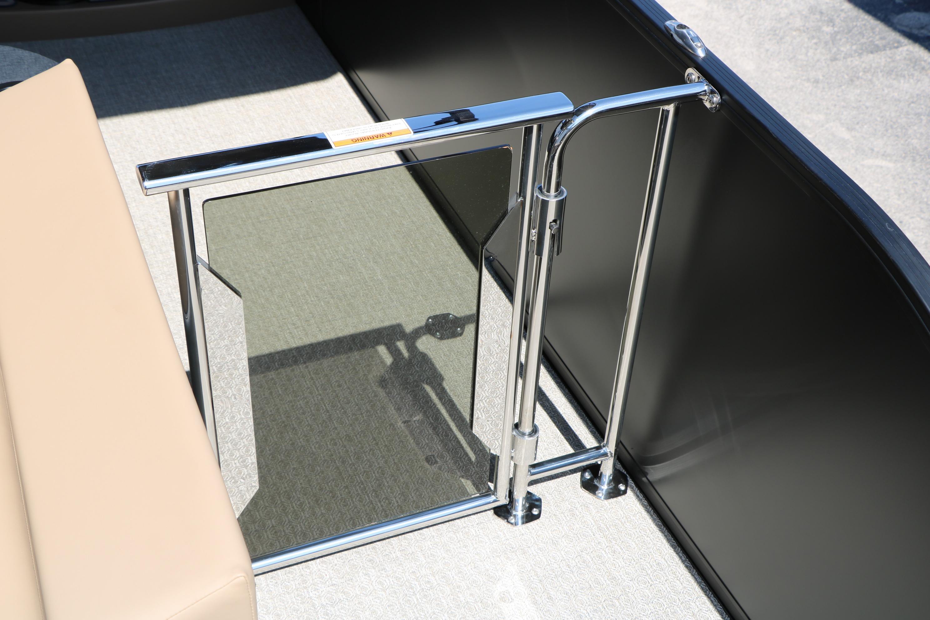 Interior view of 2026 Evotti 725 CS Tri-Toon boat with sleek metal gate.