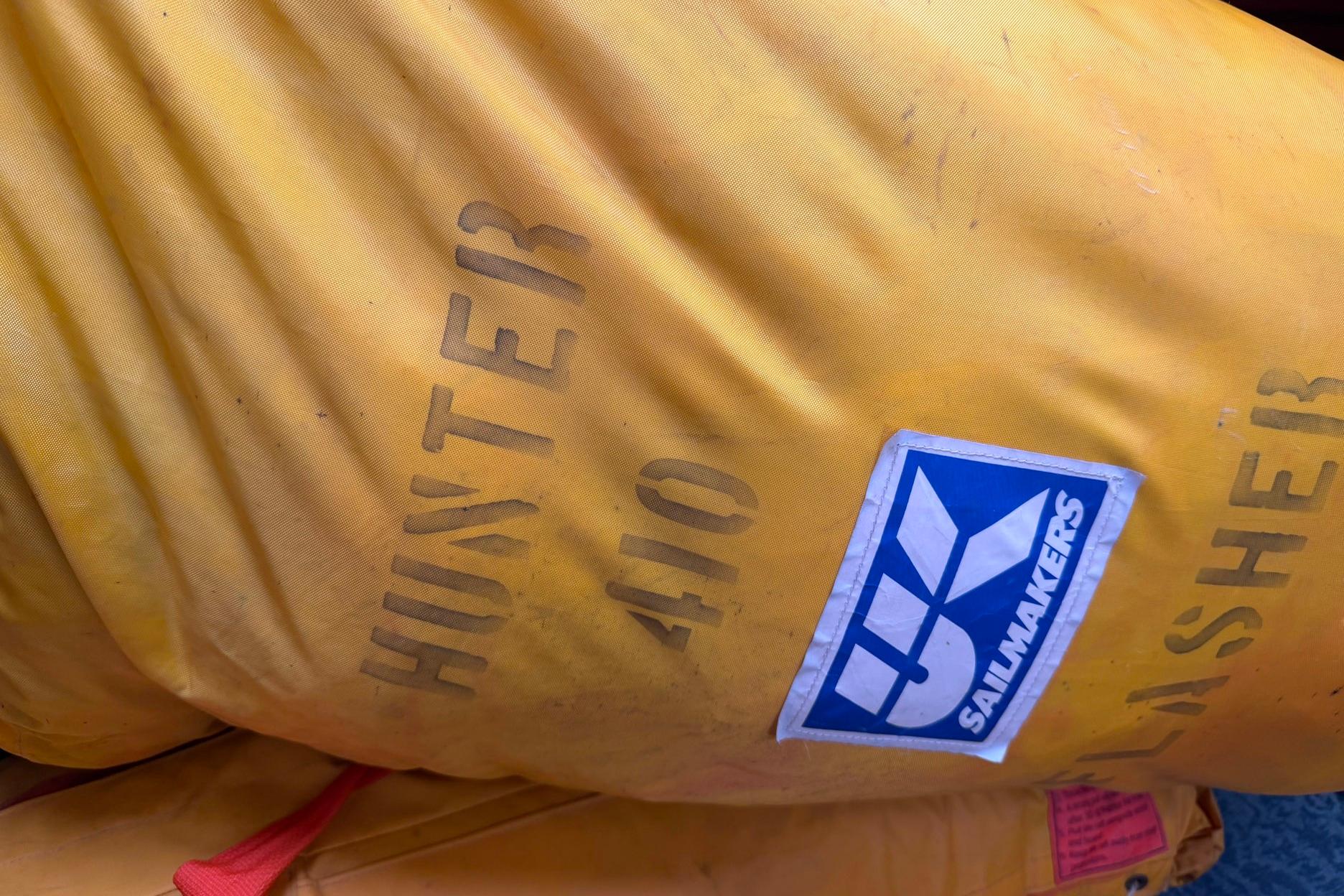 Yellow sail bag labeled "Hunter 410" with sailmaker's logo, 1998 model.