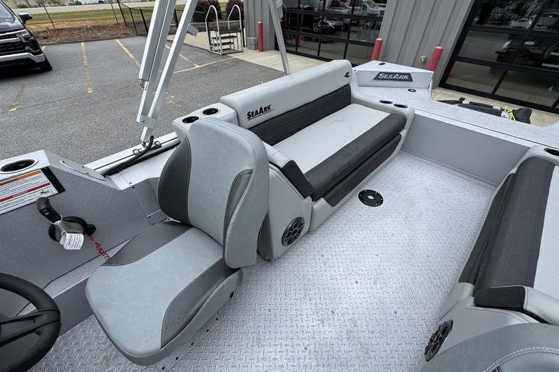 2025 SeaArk Super Lounge Easy boat interior with gray seating and steering wheel.