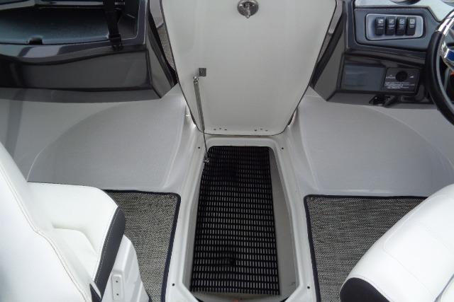 Interior view of a 2019 Monterey 218SS Super Sport boat, featuring seating and control panel.