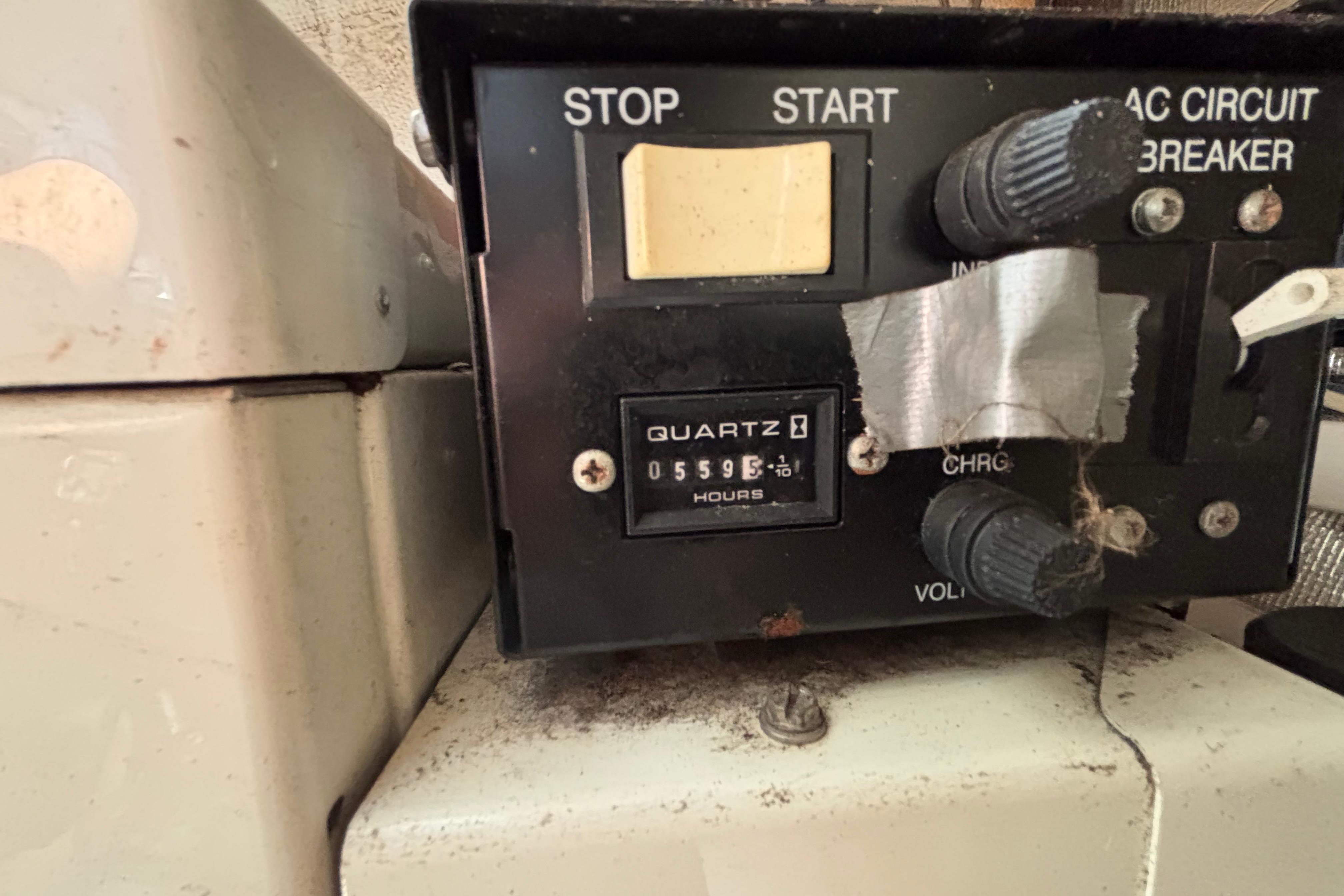 Control panel of a 2004 Chaparral Signature 330 boat, showing 5595 hours on quartz meter.