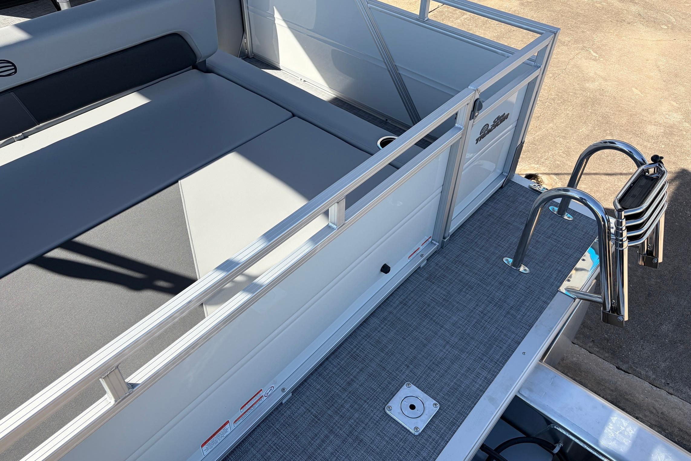 2026 Sun Tracker Party Barge 22 RF XP3 with seating and swim ladder.