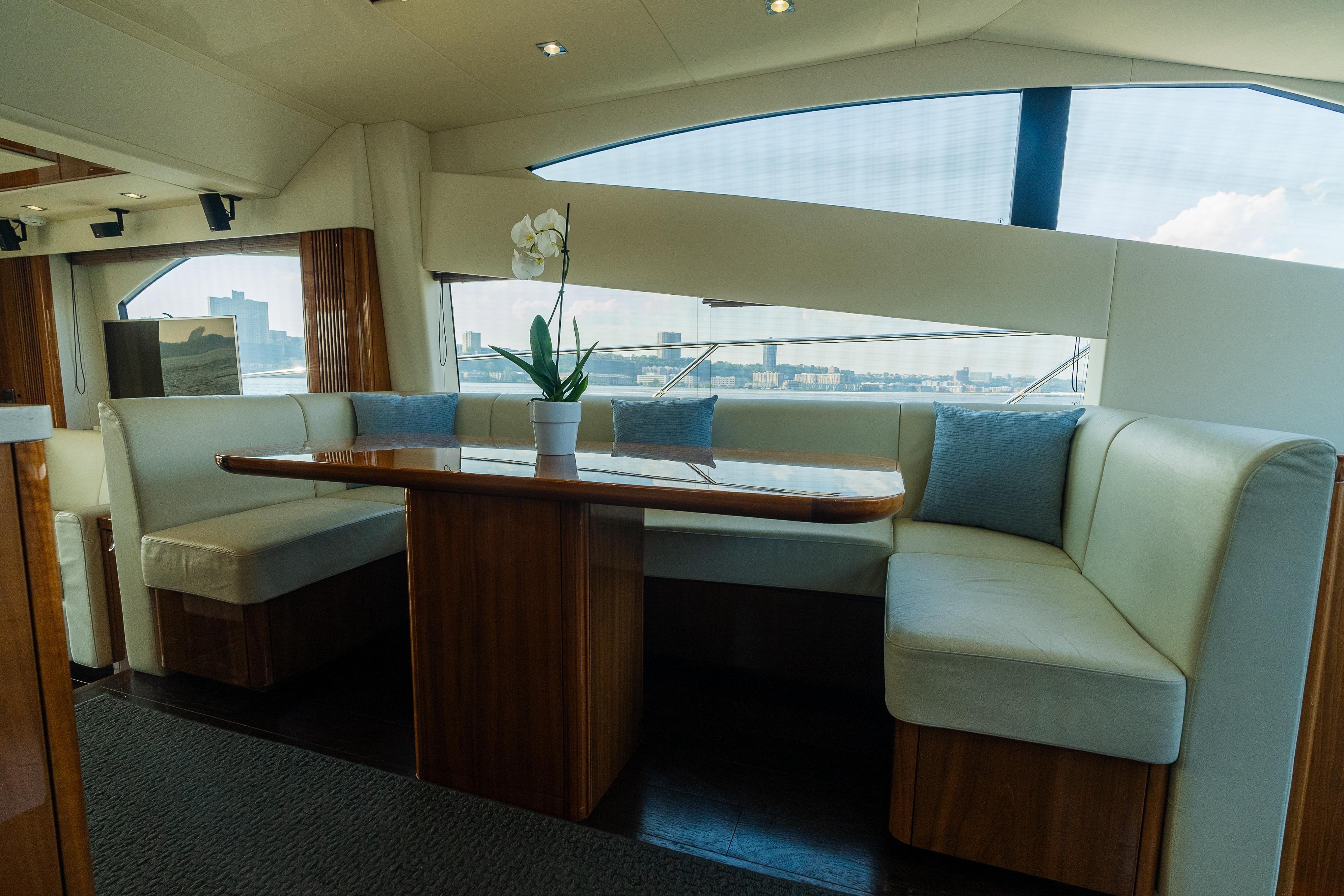 Luxurious interior of 2016 Sunseeker Manhattan 65 yacht with elegant dining area.
