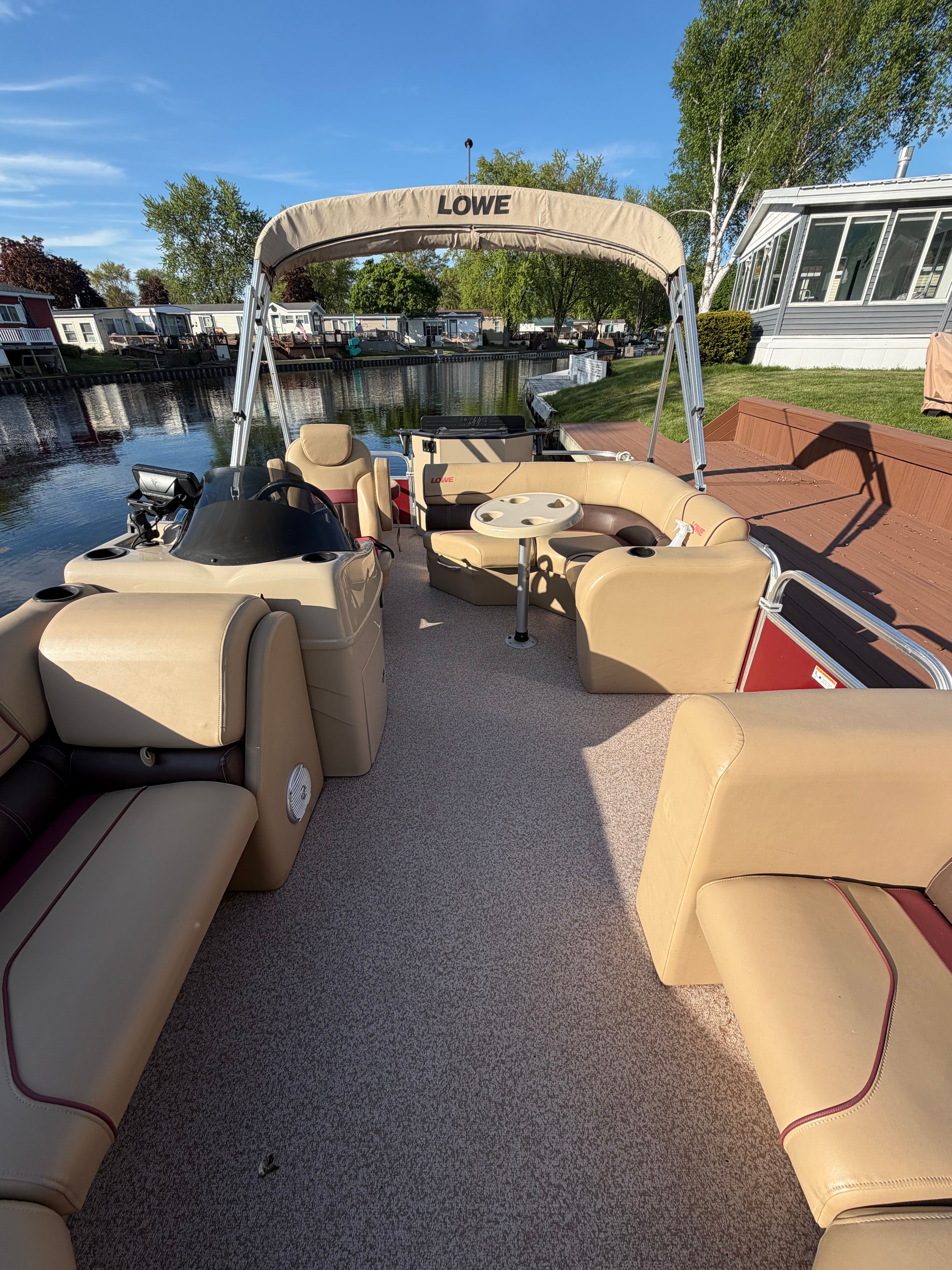 2017 Lowe SF 212 Sport Fish pontoon boat at dock.