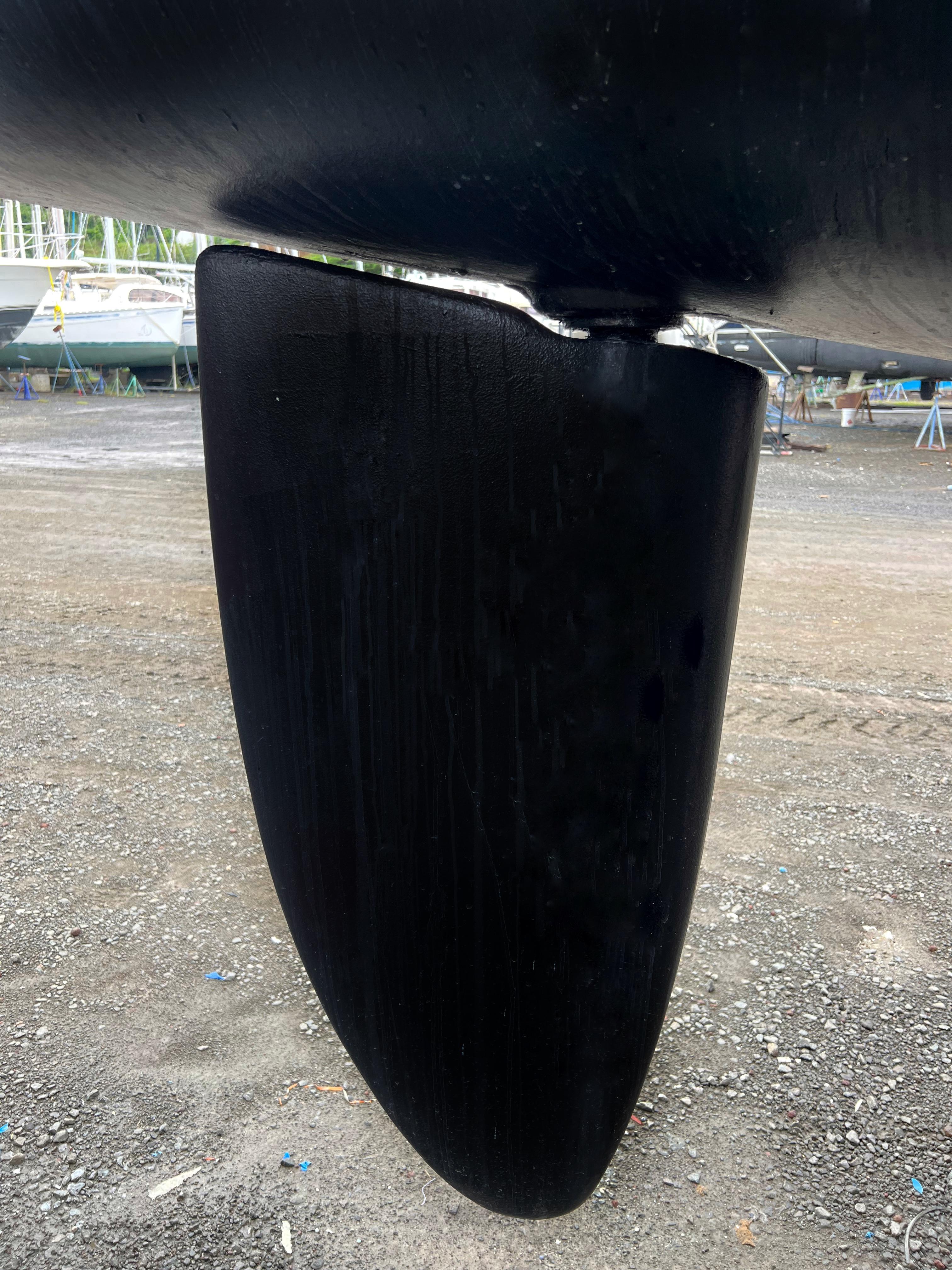 Close-up of a 1999 St Francis 44 MKII rudder on dry land.