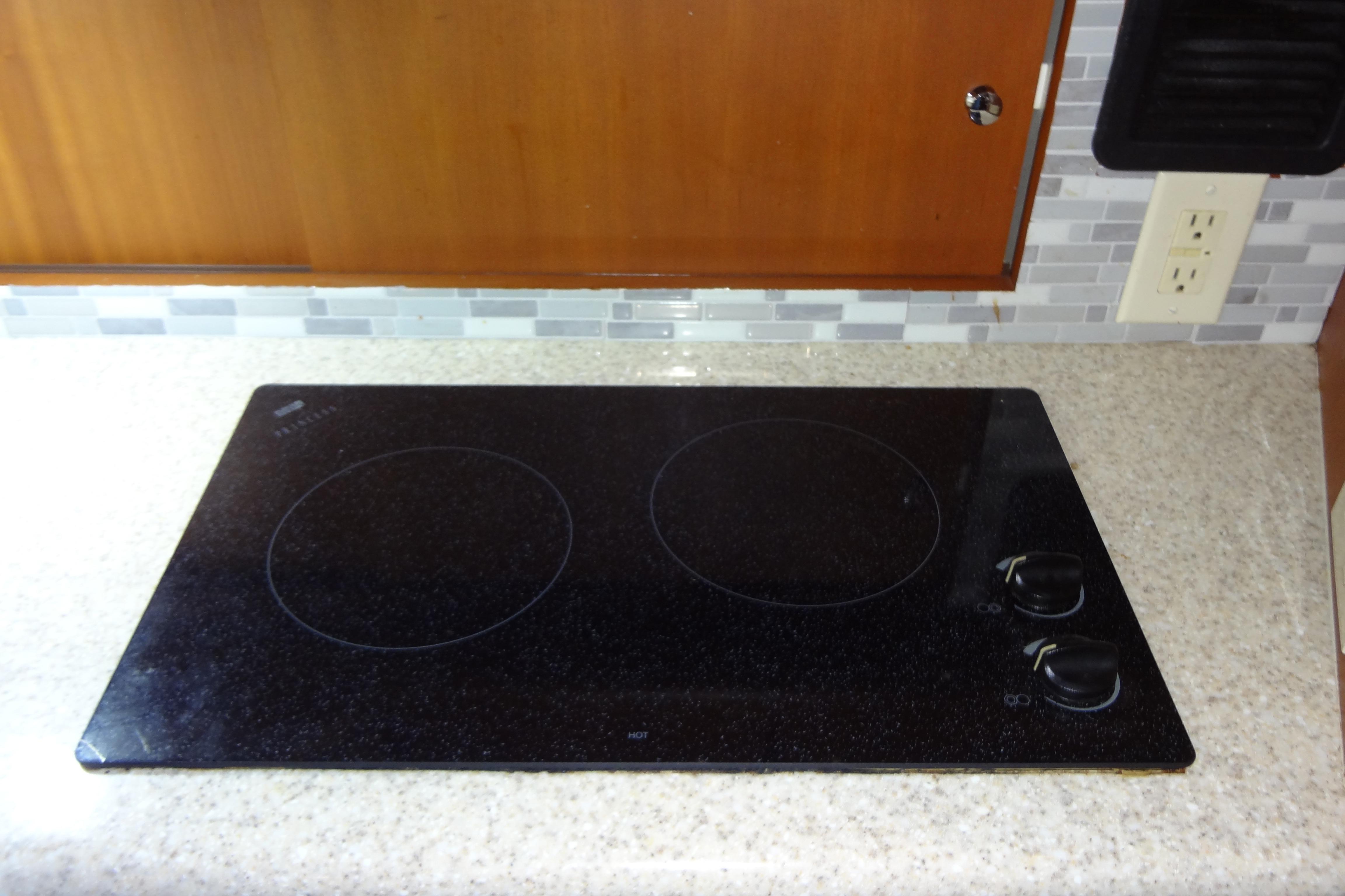 Electric stovetop on a 2005 Silverton 34 Convertible yacht kitchen counter.