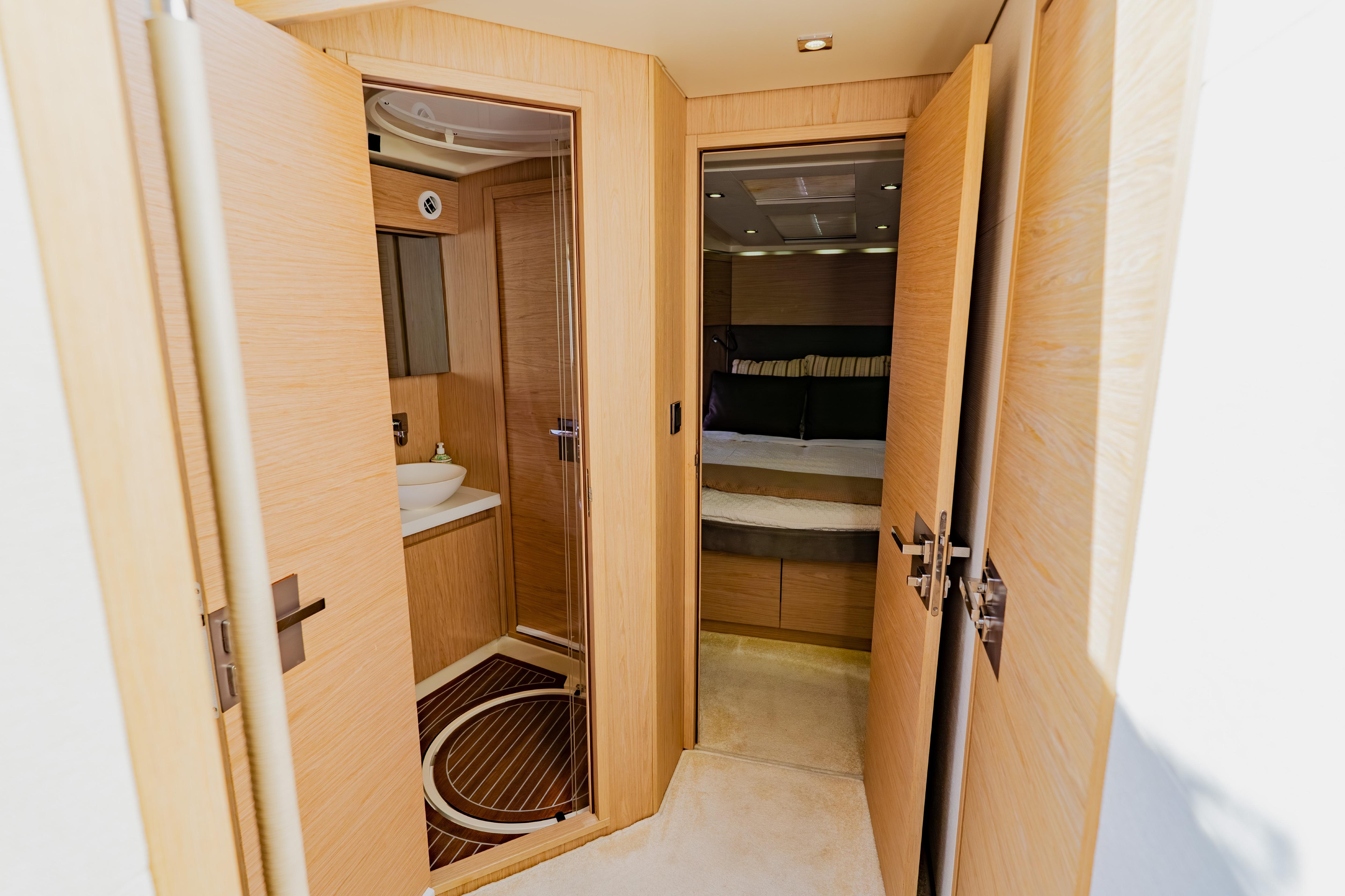 Luxurious interior of 2015 Monte Carlo MC5 yacht featuring bedroom and bathroom.