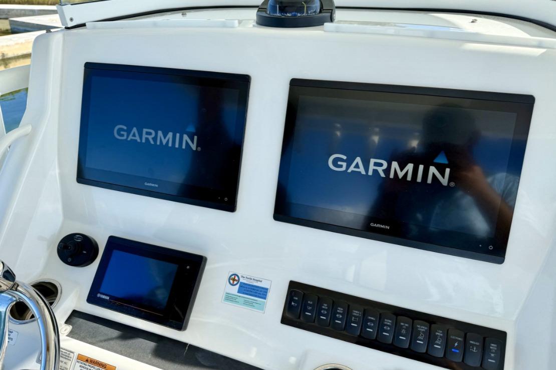 Control panel of a 2019 Regulator 31 boat with Garmin displays.