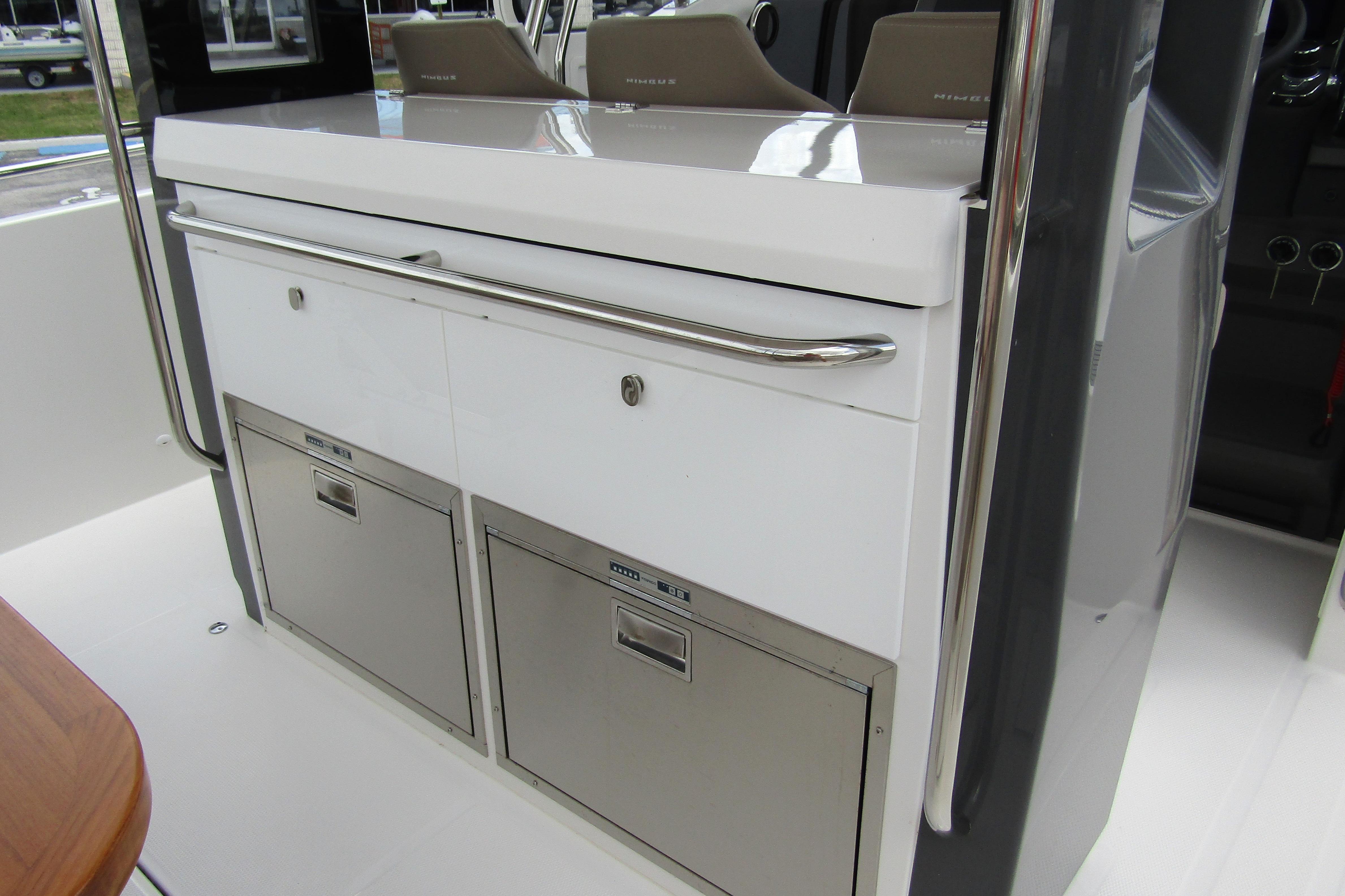 Interior of 2025 Nimbus Tender 11 boat featuring sleek storage compartments.