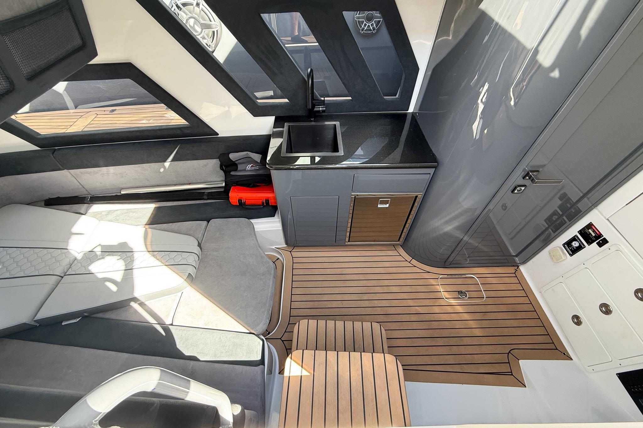 Luxurious interior of 2023 Midnight Express 43 Solstice boat with modern amenities.