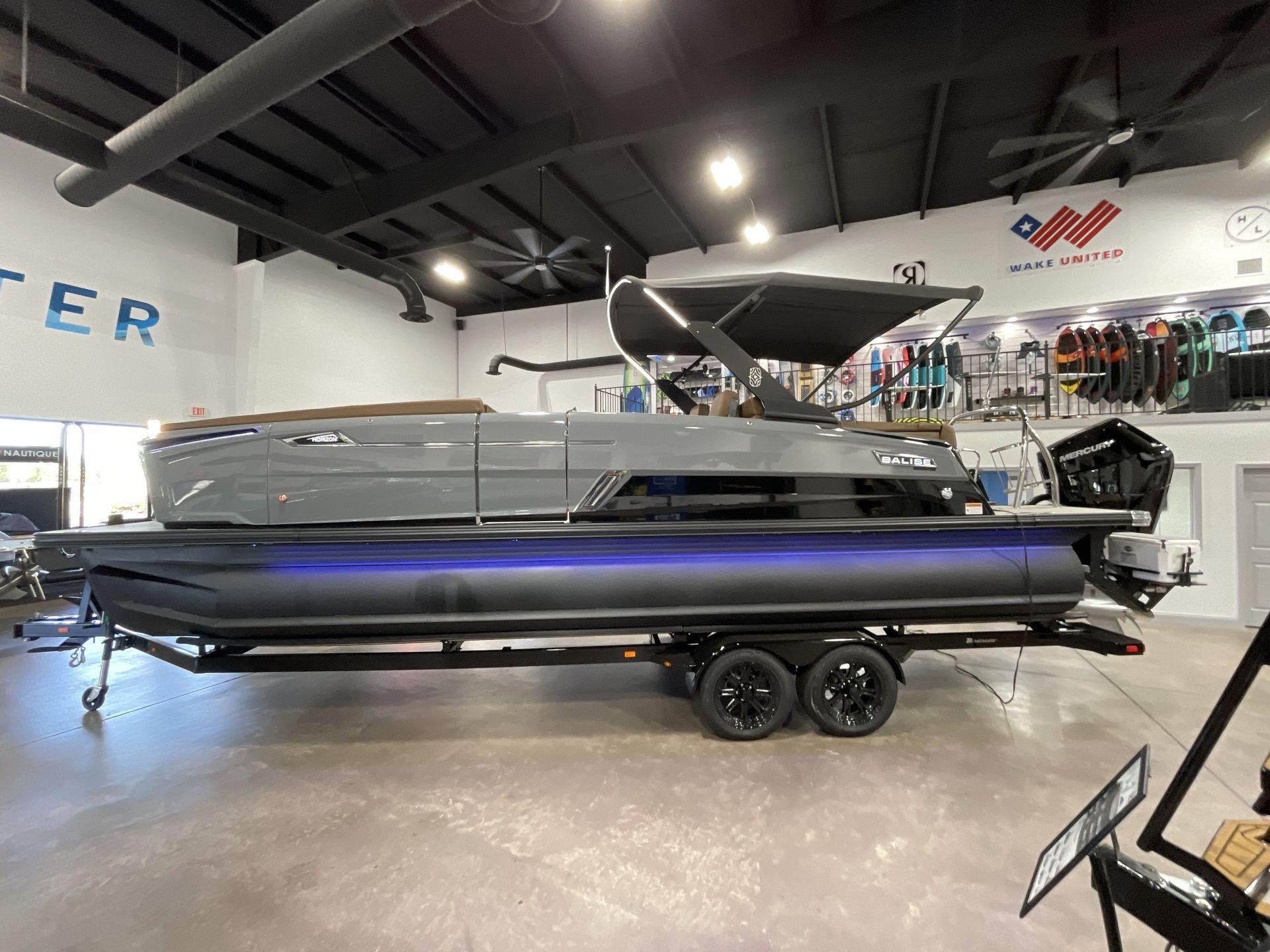 2025 Balise Horizon 26C boat displayed indoors with sleek design and modern features.
