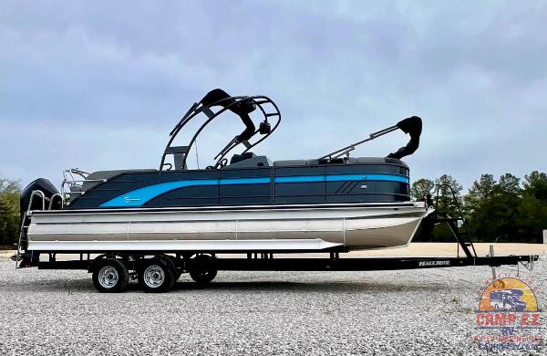 2024 Massimo Marine T-25 Ultra Lounger pontoon boat on a trailer.