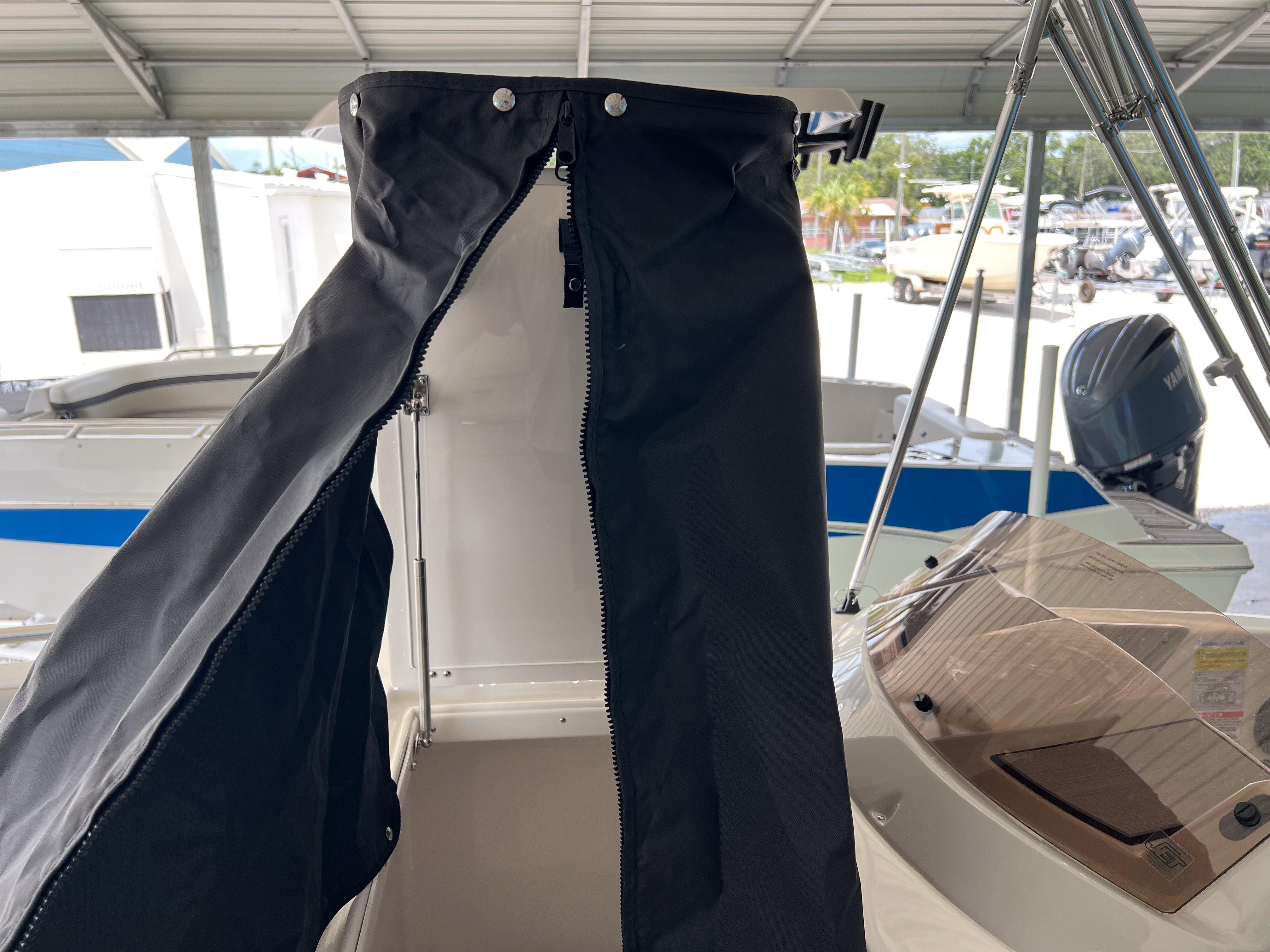 2026 Starcraft SVX 231 OB boat interior with black canopy and console details.