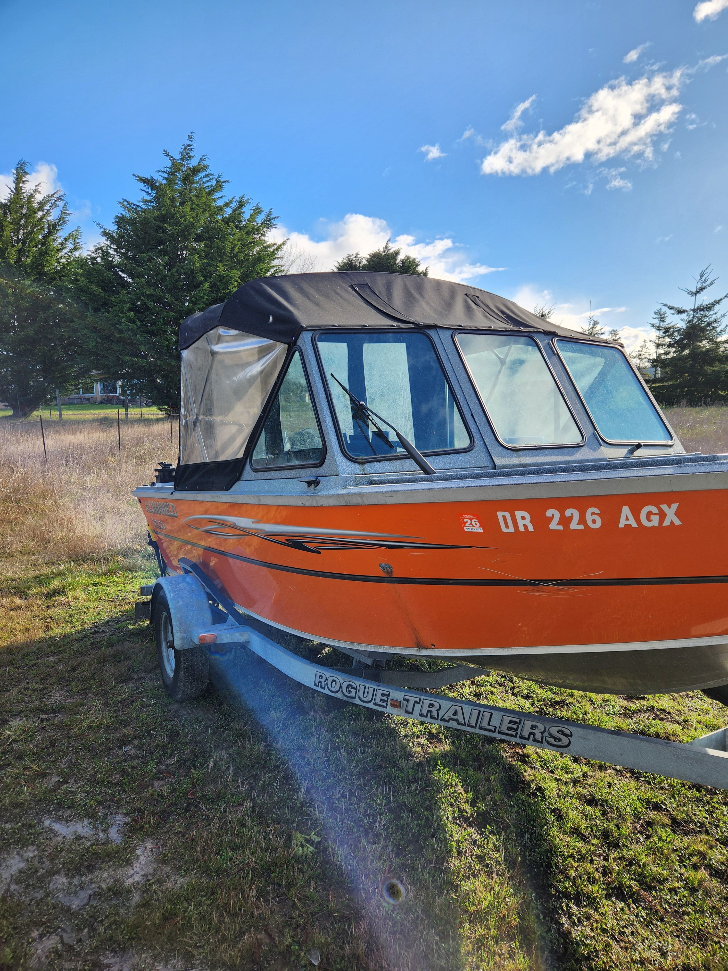 2020 Alumaweld Talon 18 boat parked on trailer outdoors.