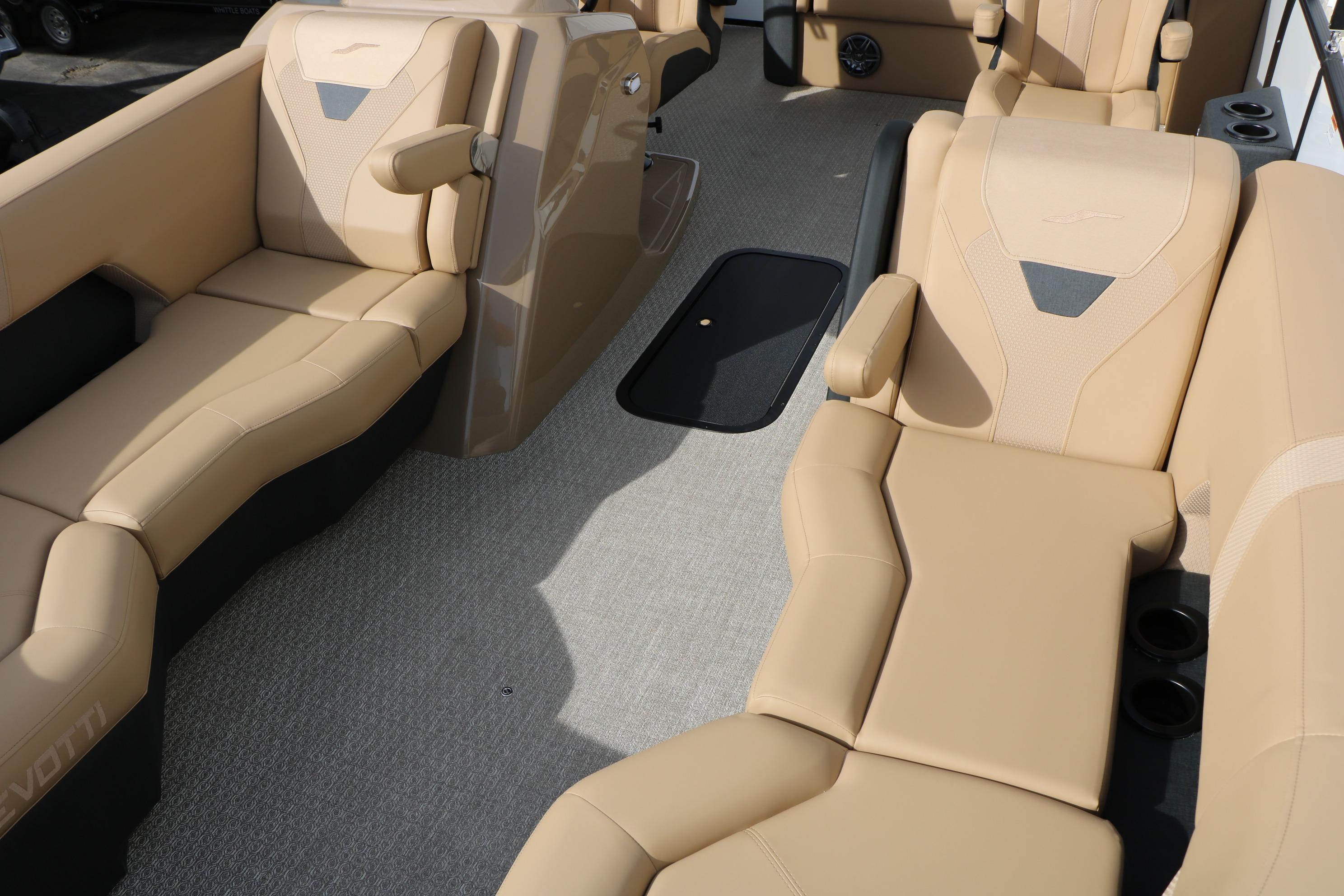 Luxurious interior of 2026 Evotti 523CS boat with beige seating and modern design.