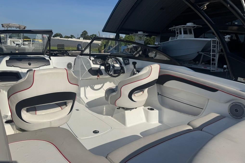 Interior of 2018 Tahoe 700 TF boat with white seating and modern dashboard.