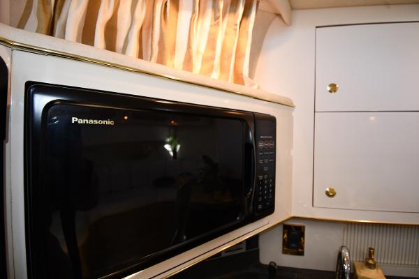 Panasonic microwave in 1997 Sea Ray 400 Sundancer yacht kitchen interior.