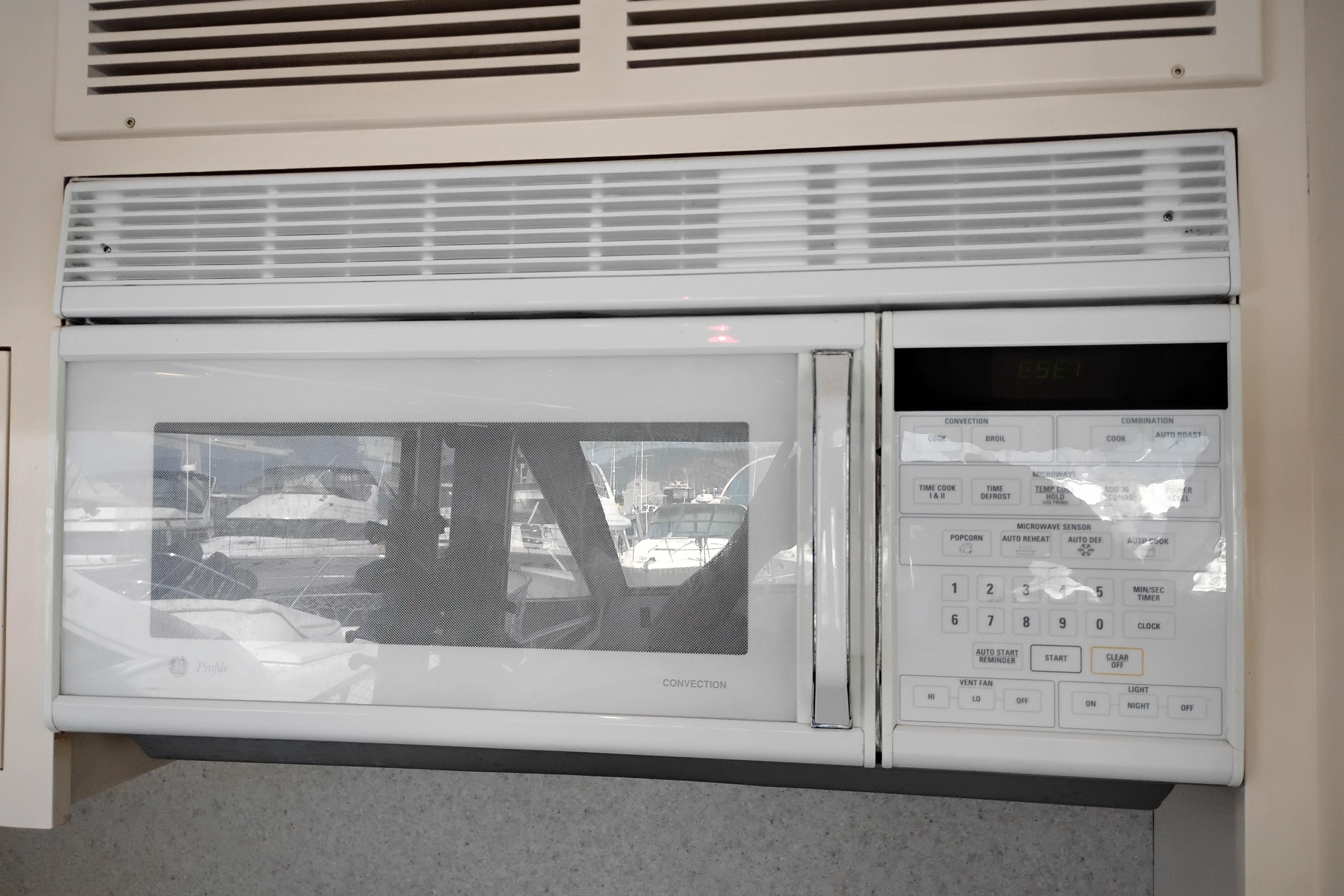 Built-in microwave oven on 1995 Queenship 62 Pilothouse Motor Yacht.
