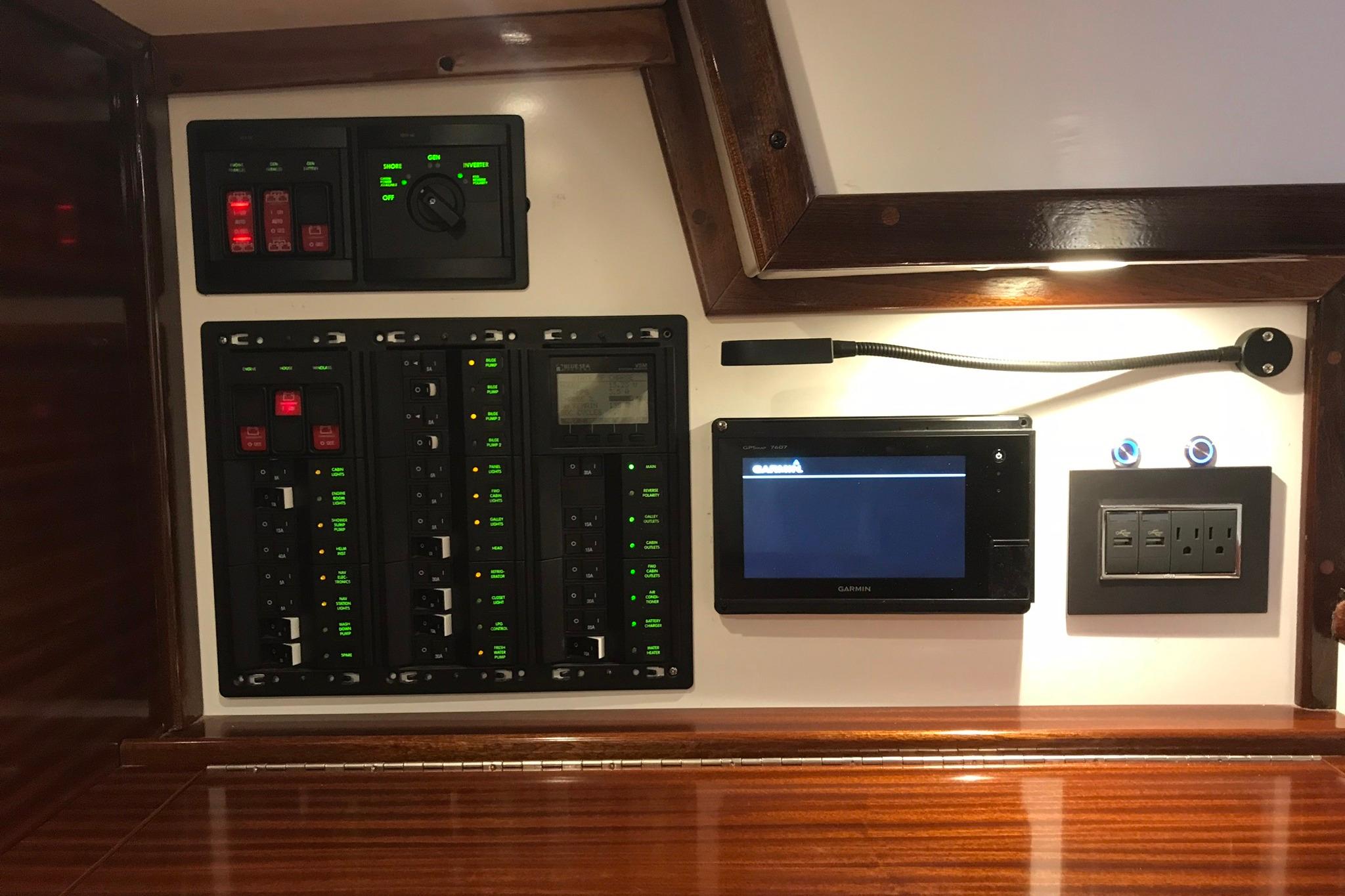 Control panel of a 1970 Hinckley Bermuda 40 yacht with modern navigation equipment.