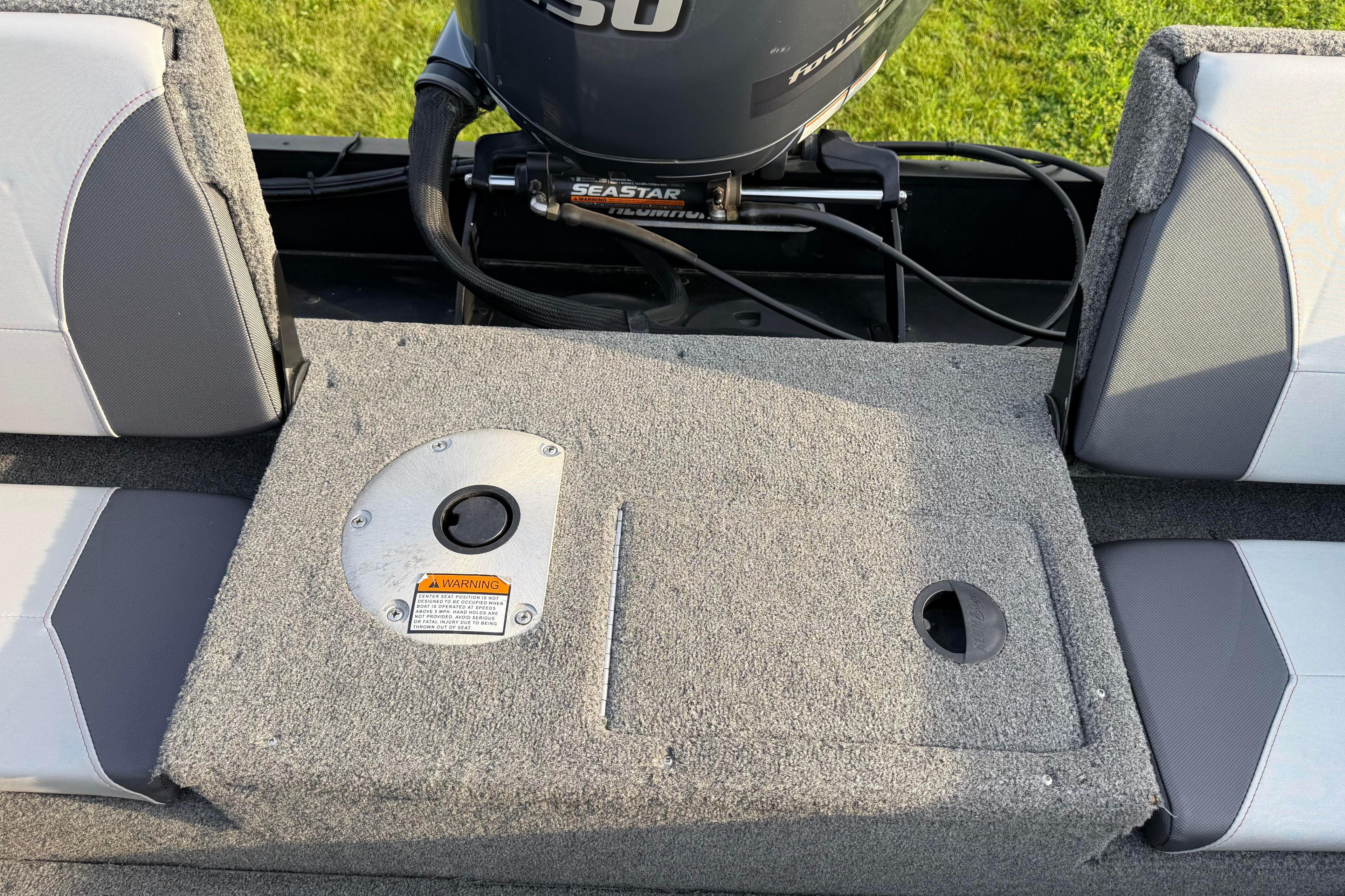 2019 Alumacraft Trophy 205 boat interior with motor and seating.