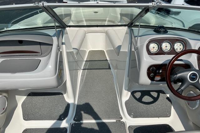 2005 Chaparral 210 SSi boat interior with steering wheel and dashboard gauges.