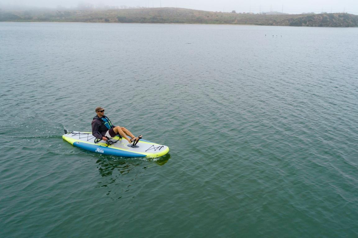 Person kayaking on a 2023 Hobie ITREK 11 in a calm lake.