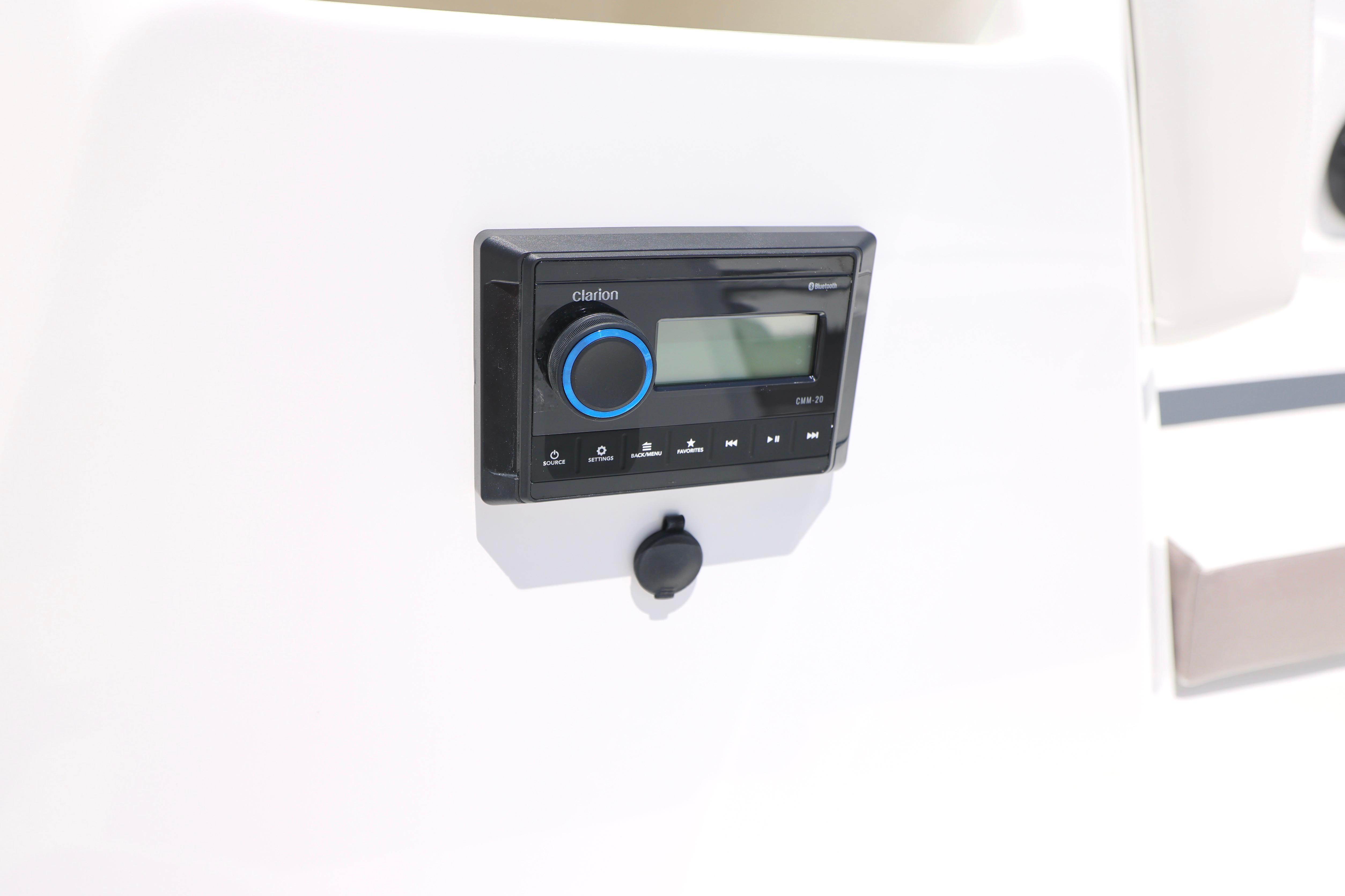 2026 Hurricane SunDeck Sport 205 OB boat stereo system with digital display.