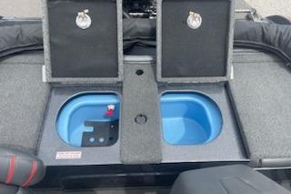 2023 Nitro ZV19 Sport boat storage compartments with open lids and blue interior.