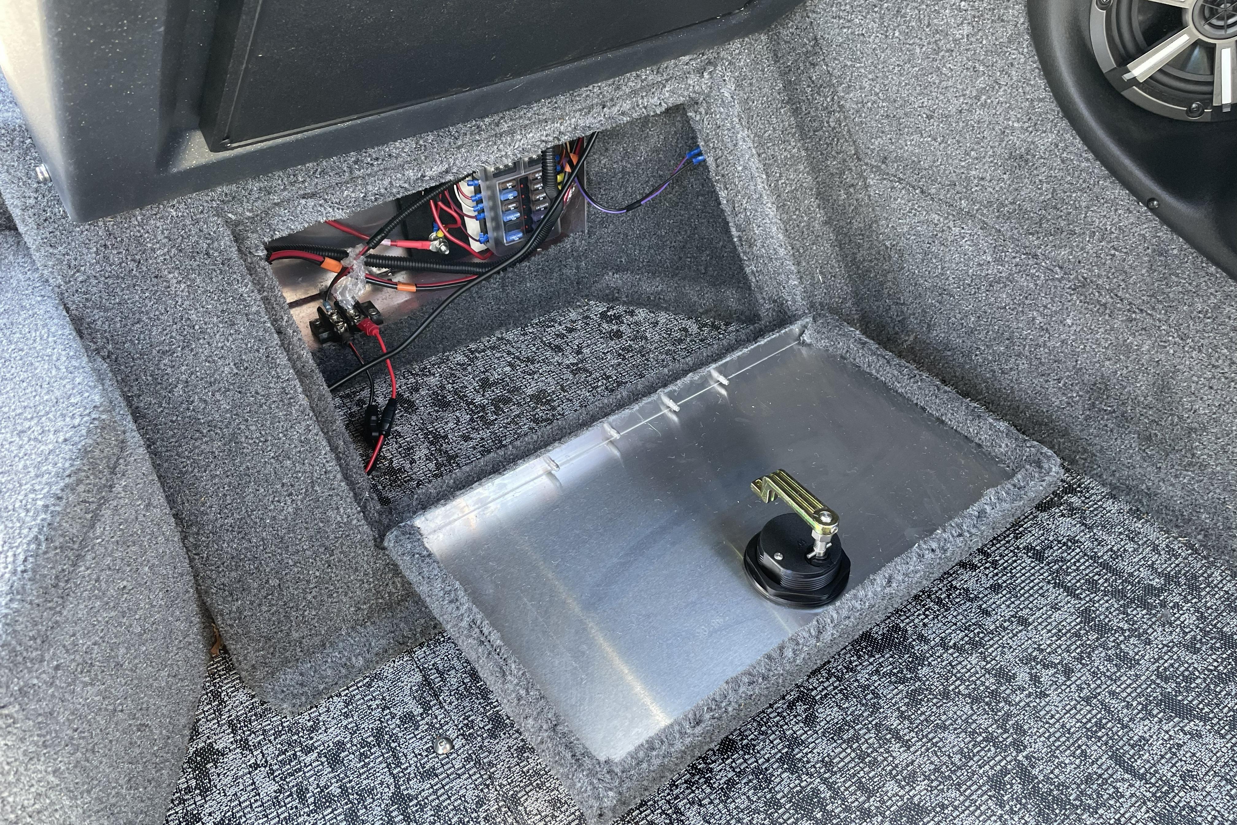 Interior view of 2026 Tracker Targa V-18 WT boat, showing wiring and speaker setup.
