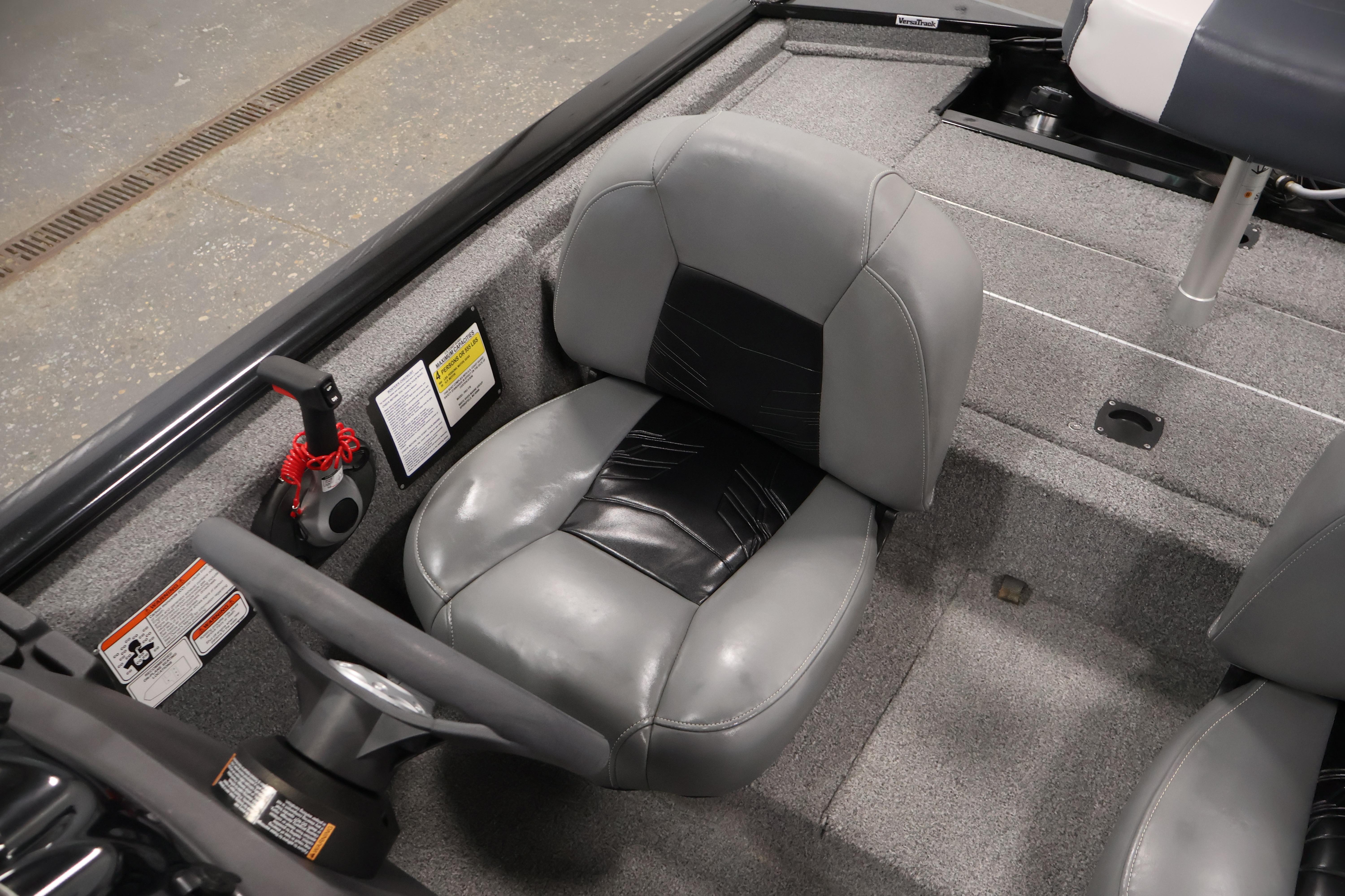 2024 Tracker Pro 170 boat interior with gray seating and steering wheel.