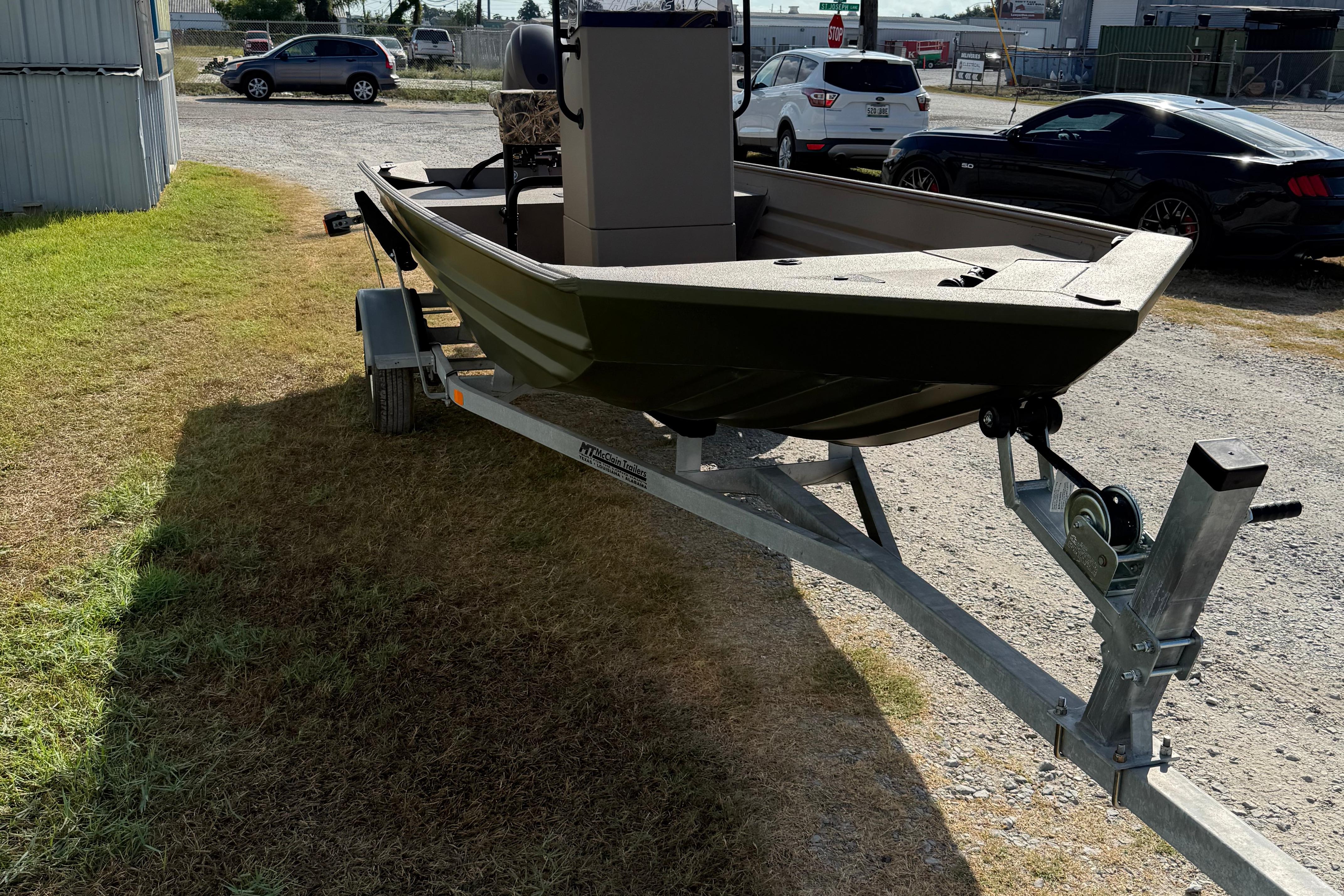 2025 Alweld 1756 V MARSH C.C. boat on trailer, parked outdoors.