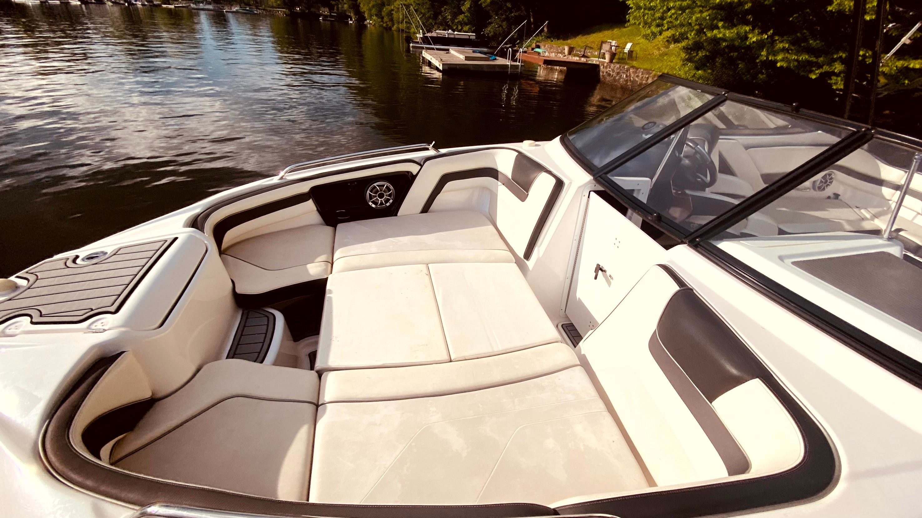 Interior of a 2016 Yamaha AR240 boat by the lake.