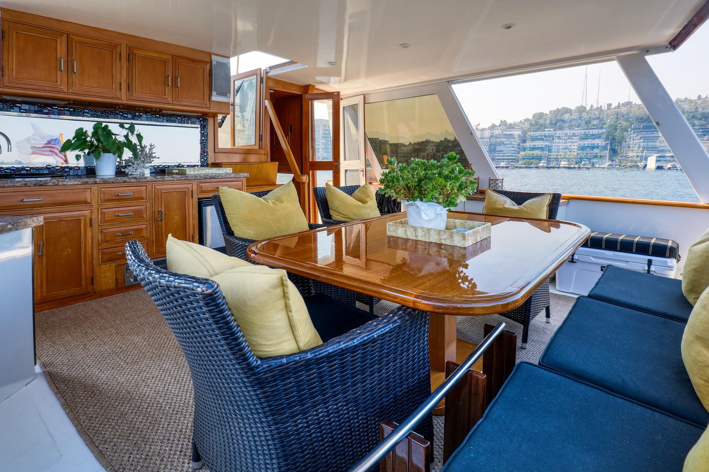 Luxurious interior of 1987 Ocean Alexander 480 Sport Sedan yacht with elegant dining area.