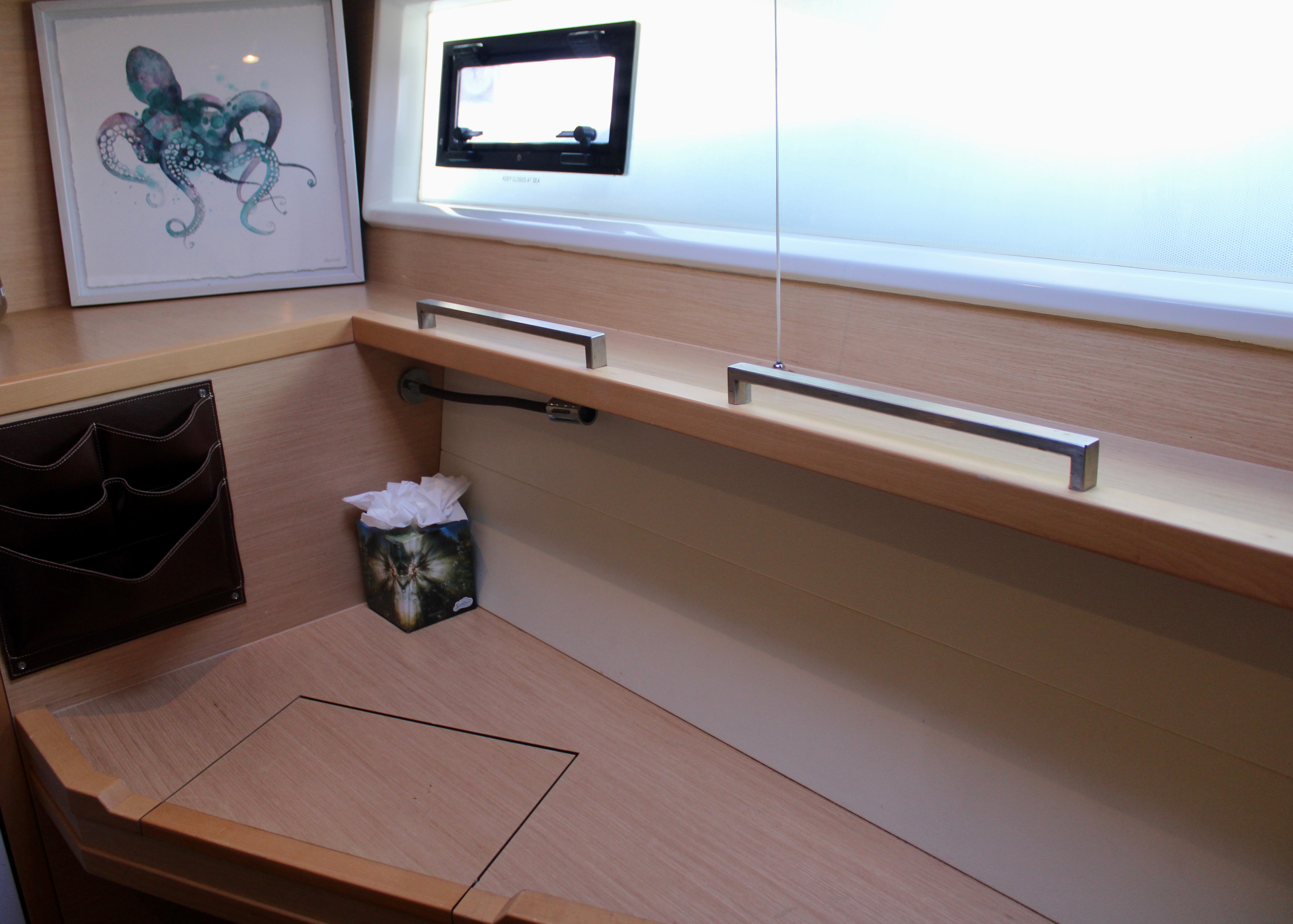 Lagoon 620 2015 yacht interior desk with window, artwork, and tissue box.