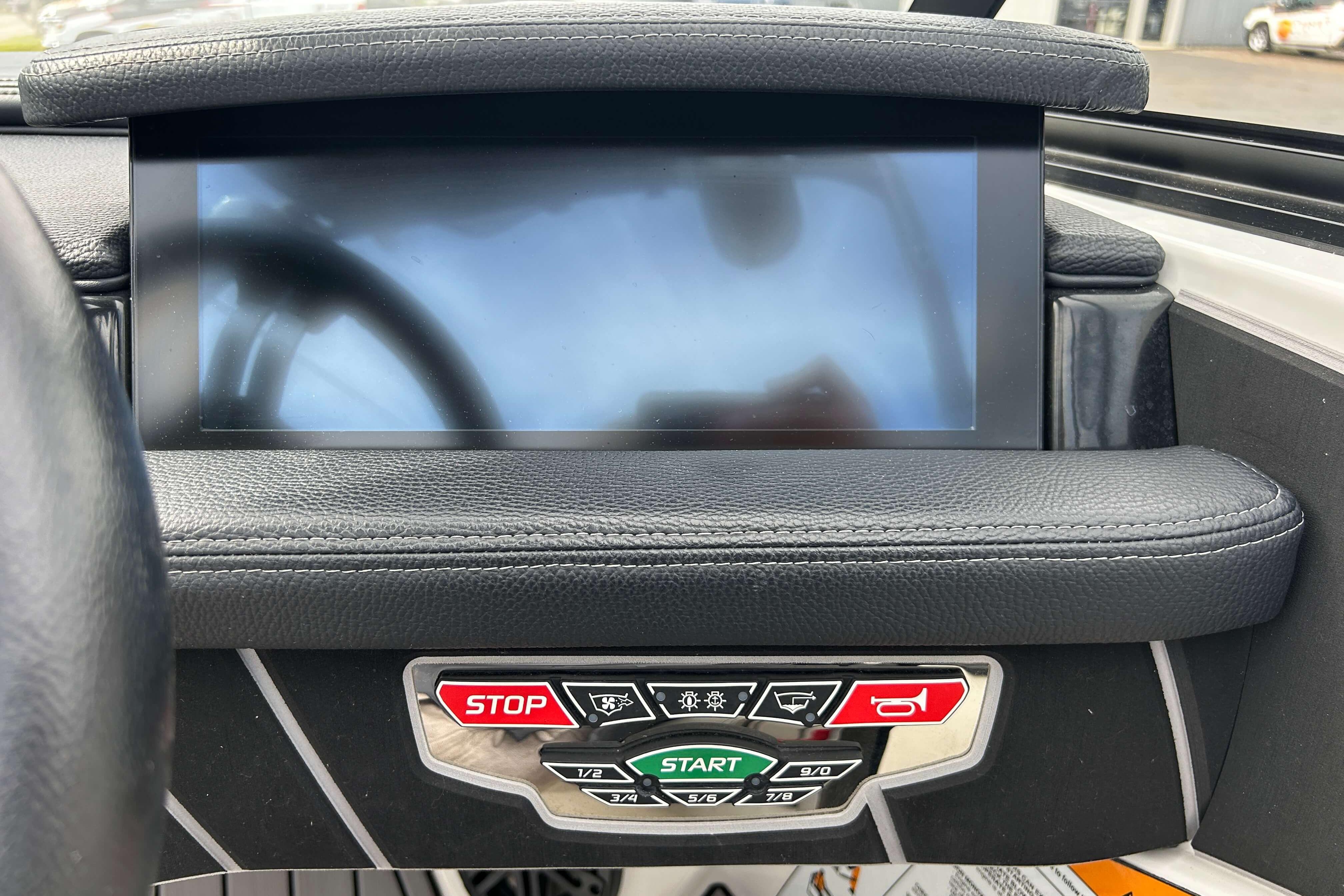 2021 Nautique Super Air Nautique GS24 dashboard with touchscreen and control buttons.