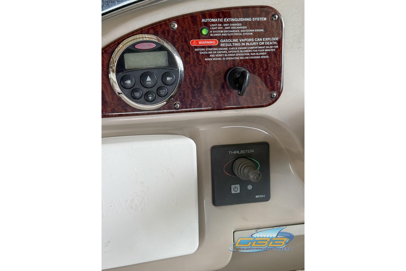 Control panel of a 2006 Sea Ray Sundancer 260 boat with thruster joystick.