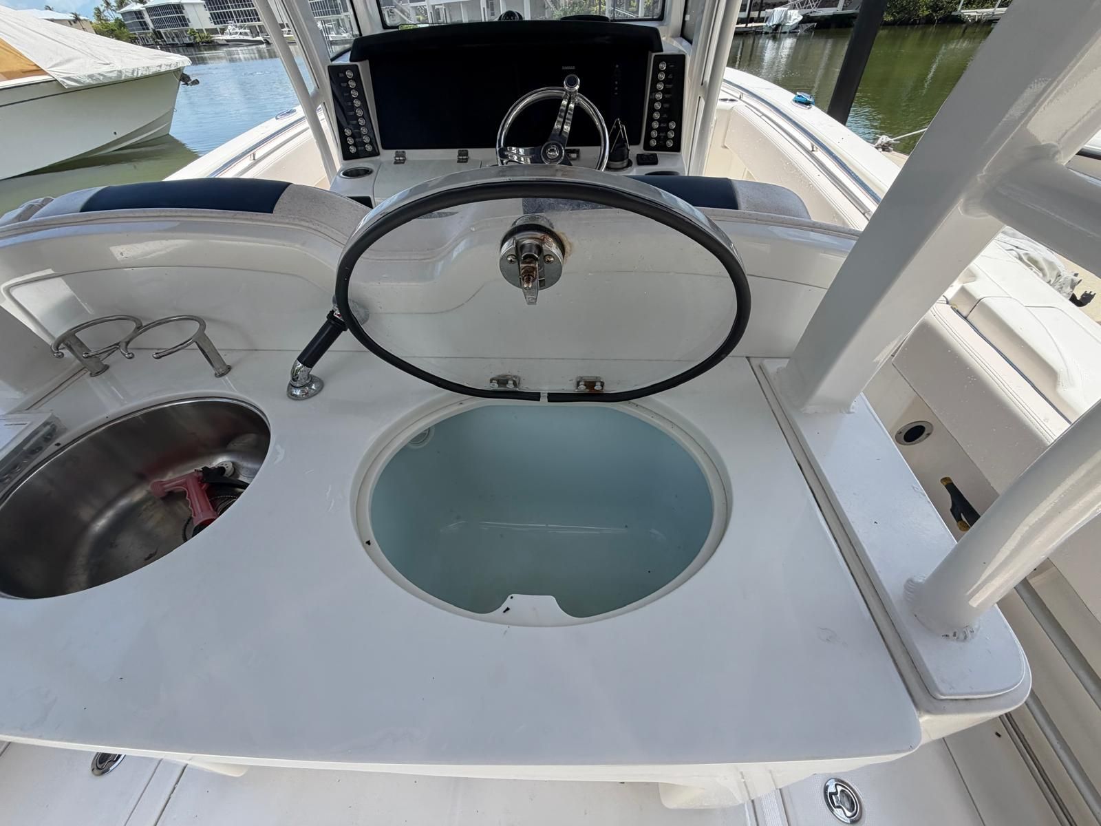 2017 Robalo R302 Center Console with helm and sink.
